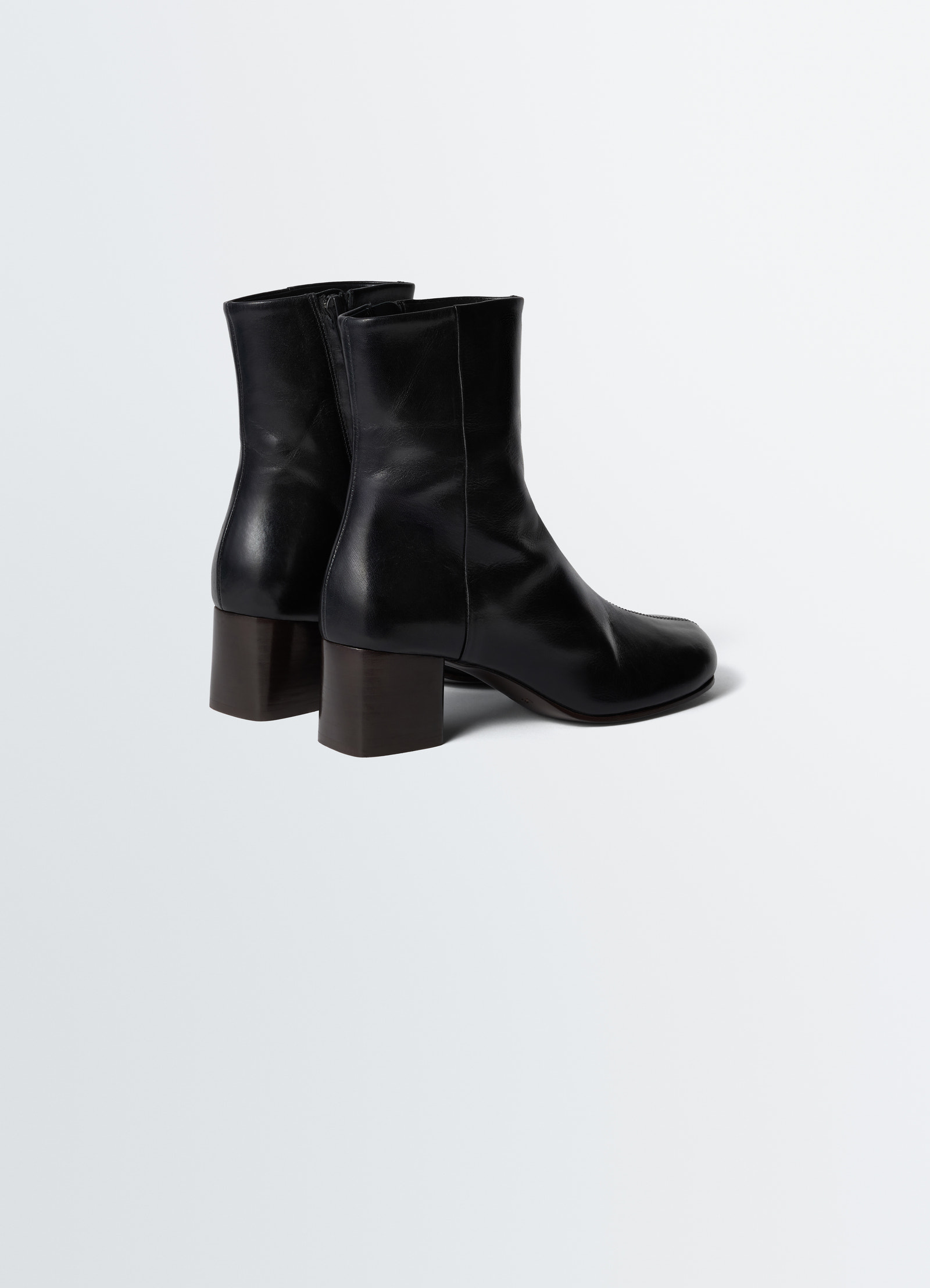 Anatomic black leather boots with 55mm block heel by lemaire side view on plain white background