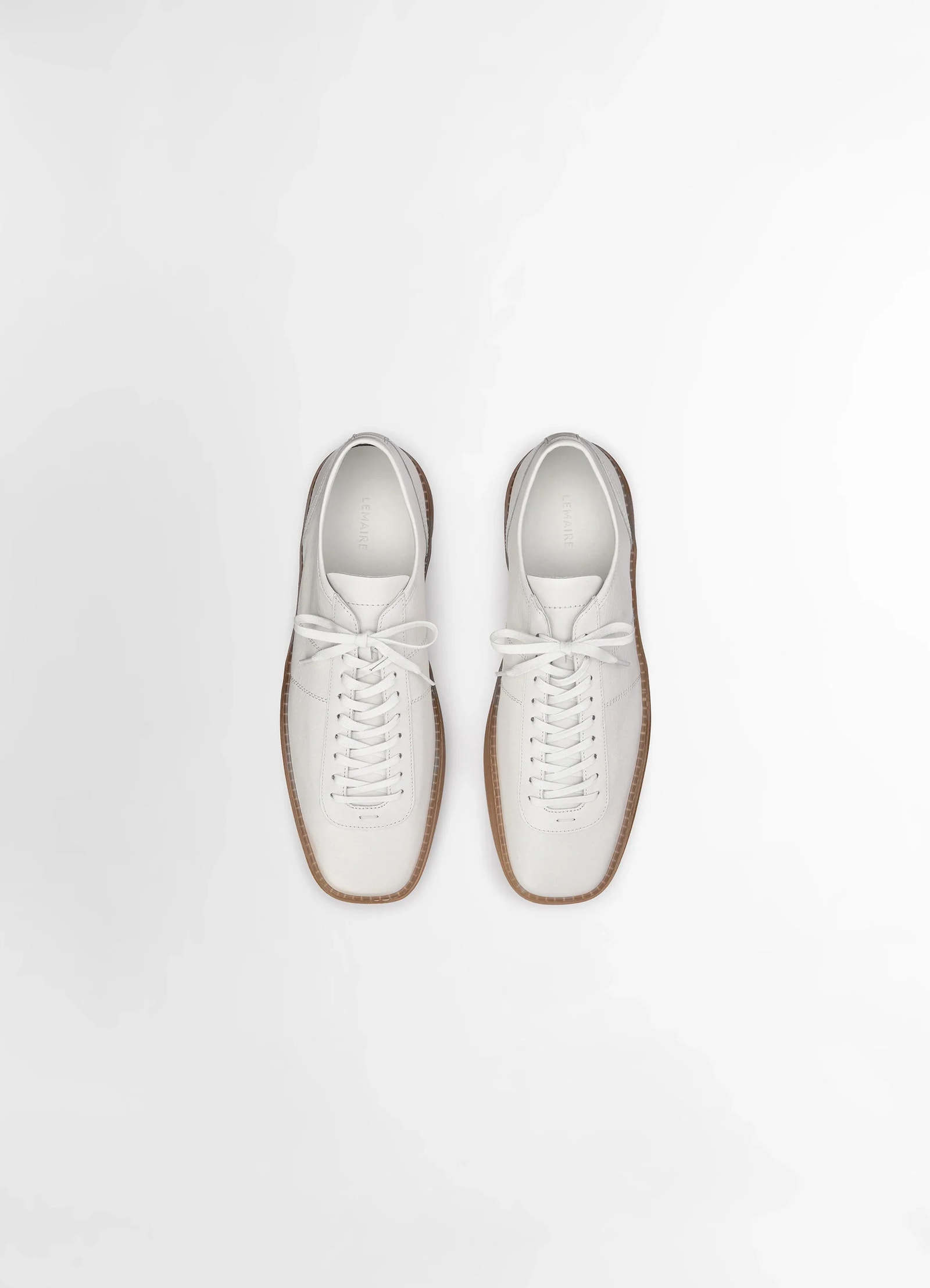 Lemaire linoleum laced up trainers in smooth soft cow leather, product shot, overhead pair view minimalist laced round top