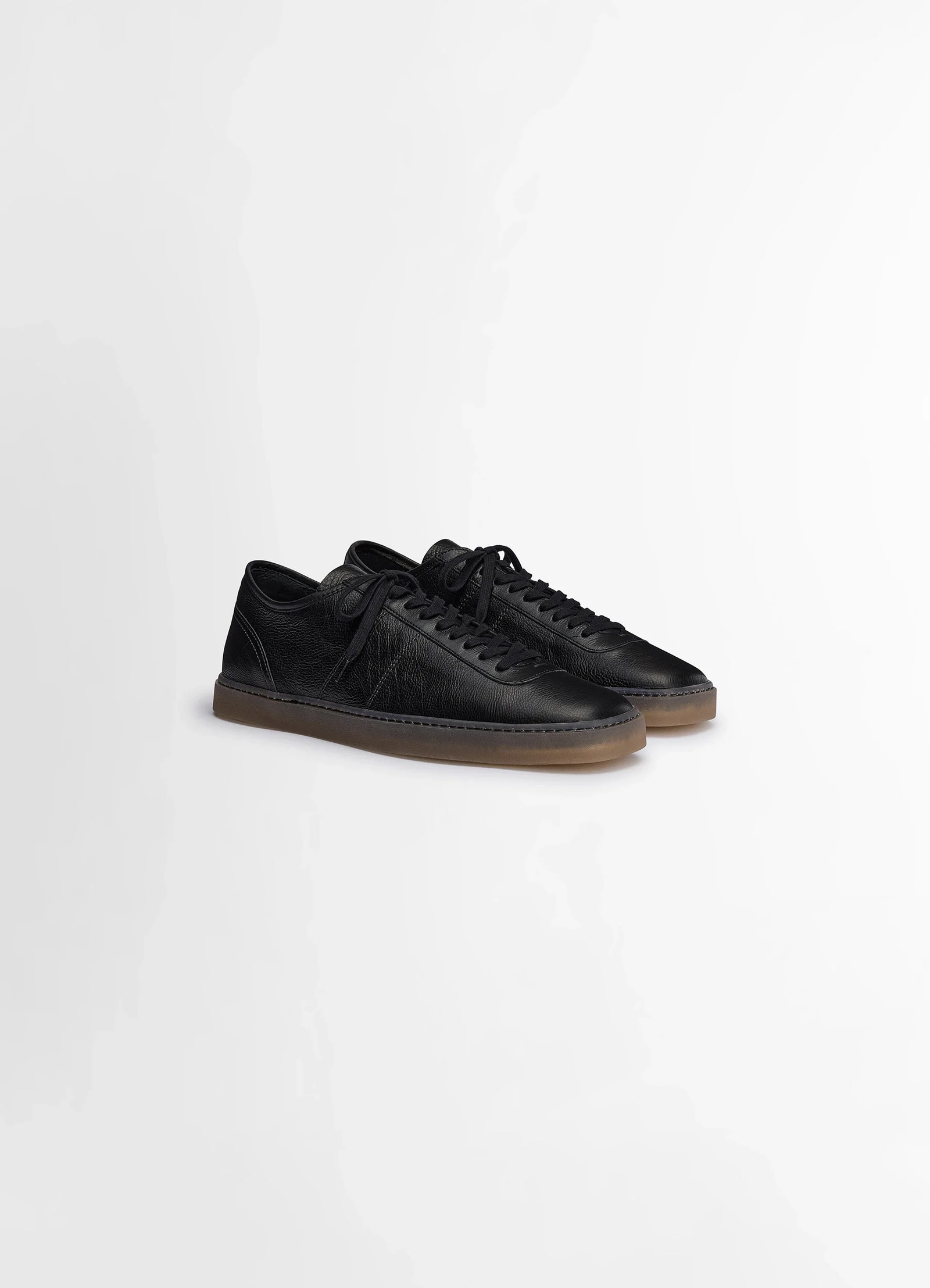 Linoleum laced up sneakers in black smooth soft cow leather, product shot, three-quarter view contrasting gum sole