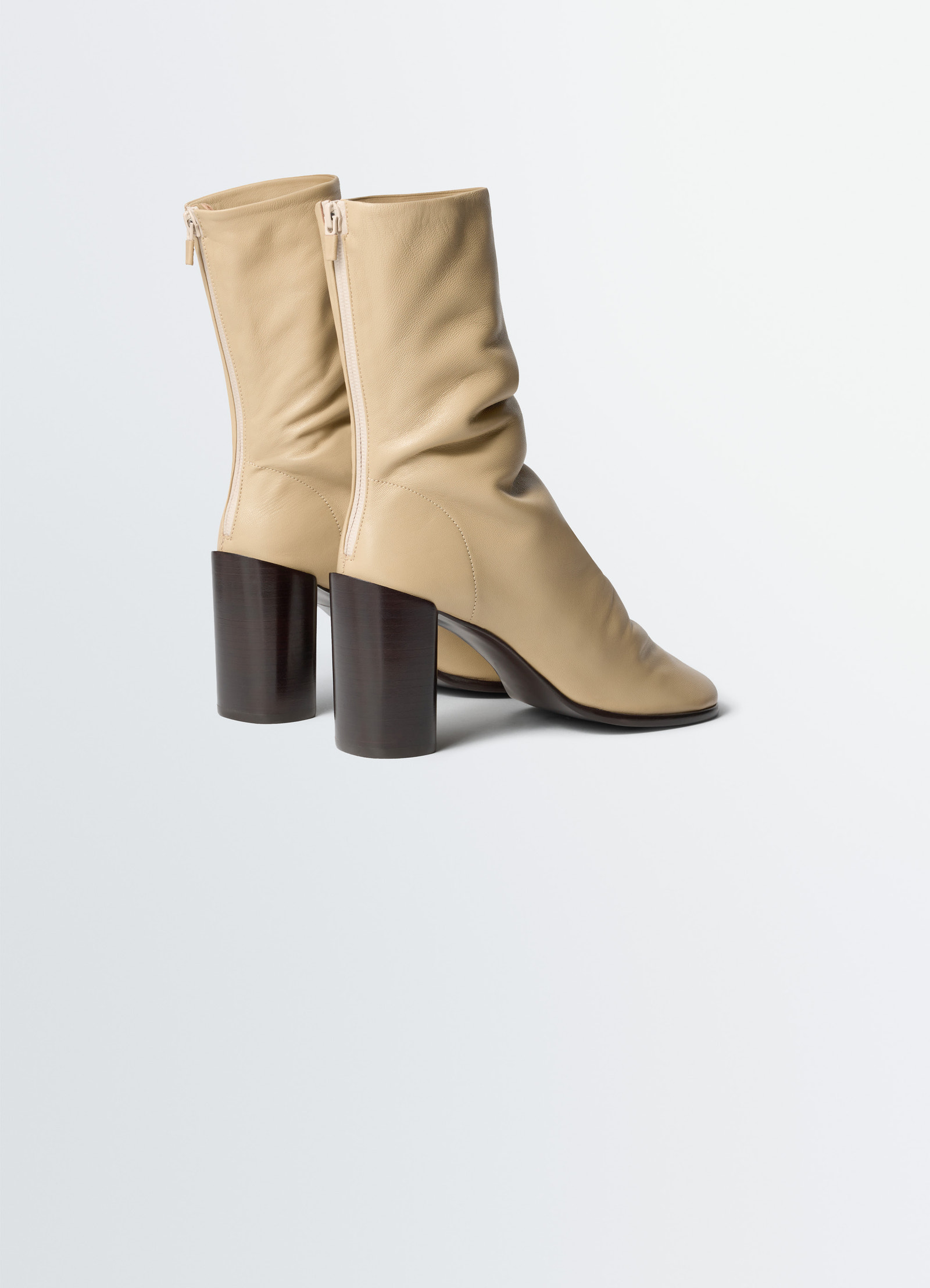 Glove ankle boots in lwg gold-certified lambskin, product shot, back three-quarter view visible back zip detail