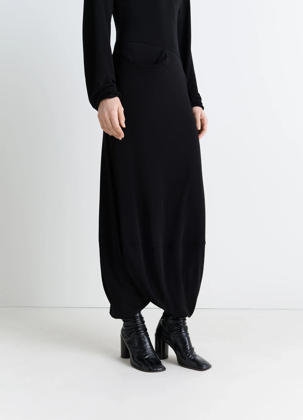 Glove Ankle Boots 80 in Eel Leather Black, model shot, worn side view wrinkled texture