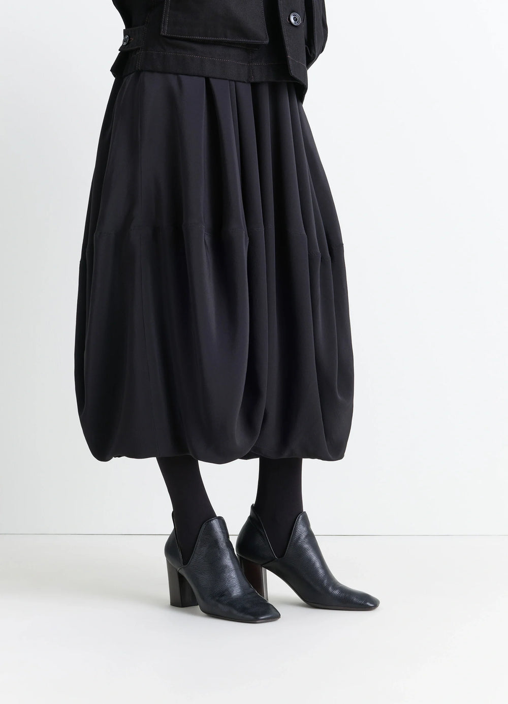 Lemaire DOrsay Pump 80 in Black Grained Goatskin, model shot, three-quarter view pointed toe