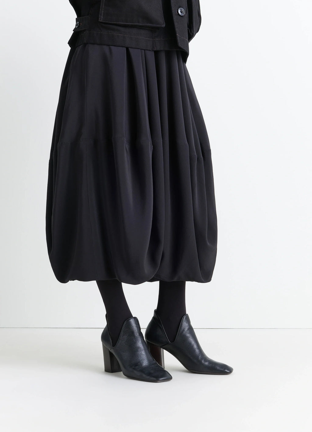 Lemaire DOrsay Pump 80 in Black Grained Goatskin, model shot, three-quarter view pointed toe