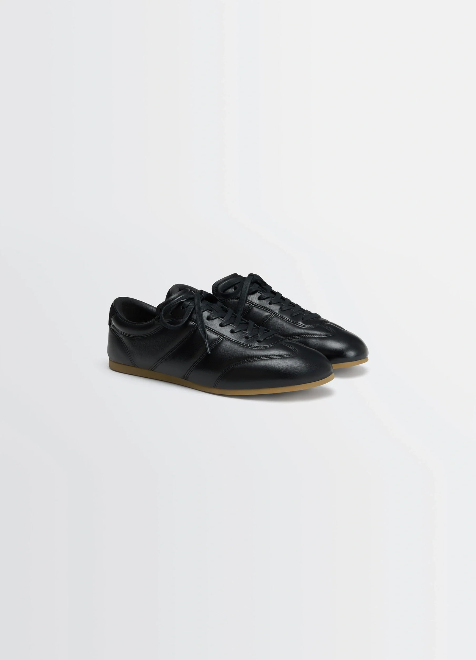 Vintage running sneakers in black nappa lamb leather, product shot, three-quarter view smooth leather finish