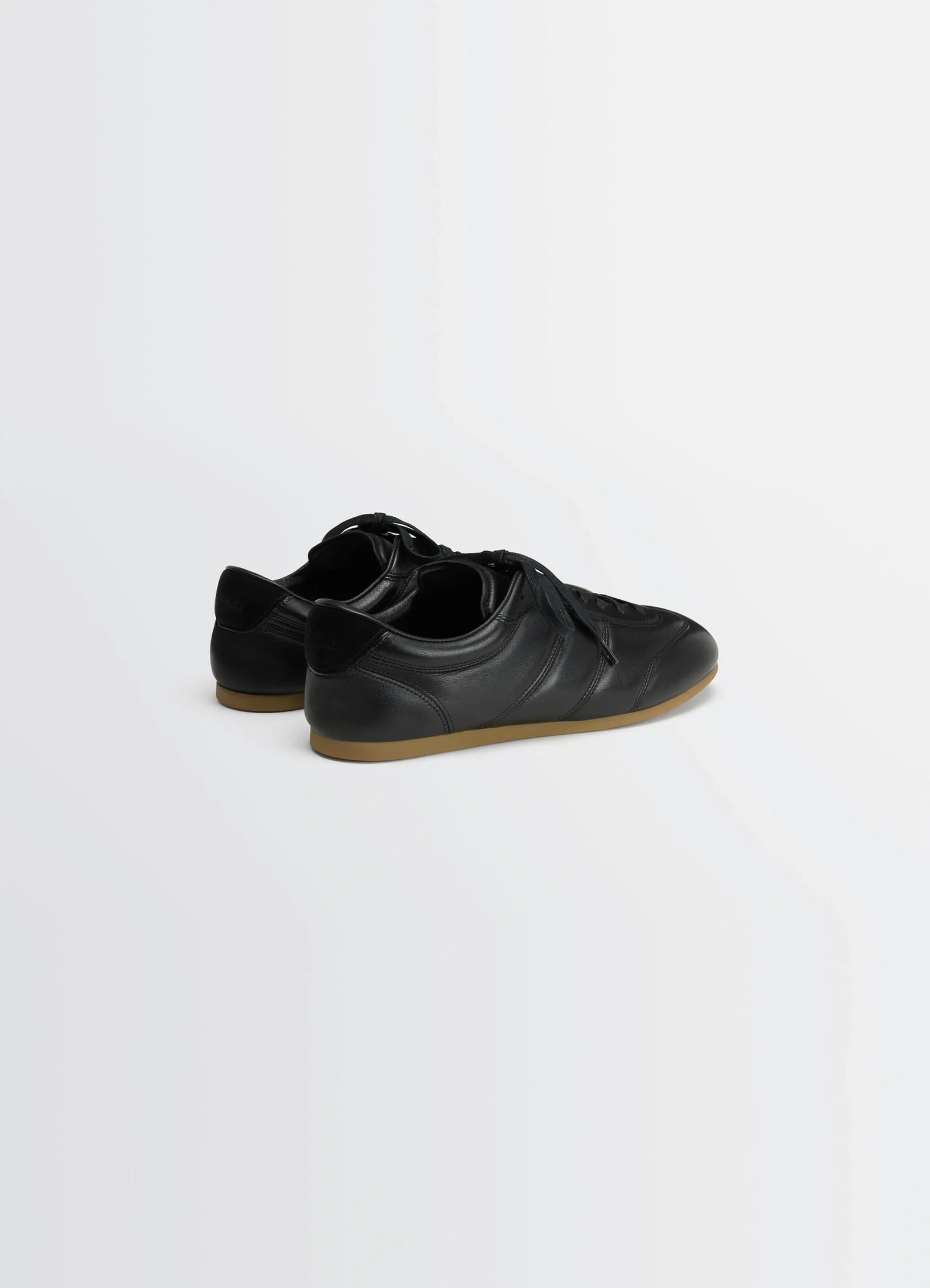 Vintage running sneakers in black nappa lamb leather, product shot, back angled view padded heel, shiny finish