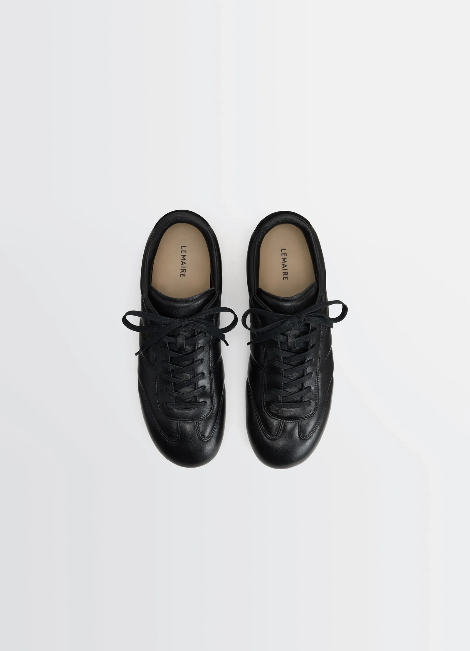Vintage running sneakers in black nappa lamb leather, product shot, top view lace-up design