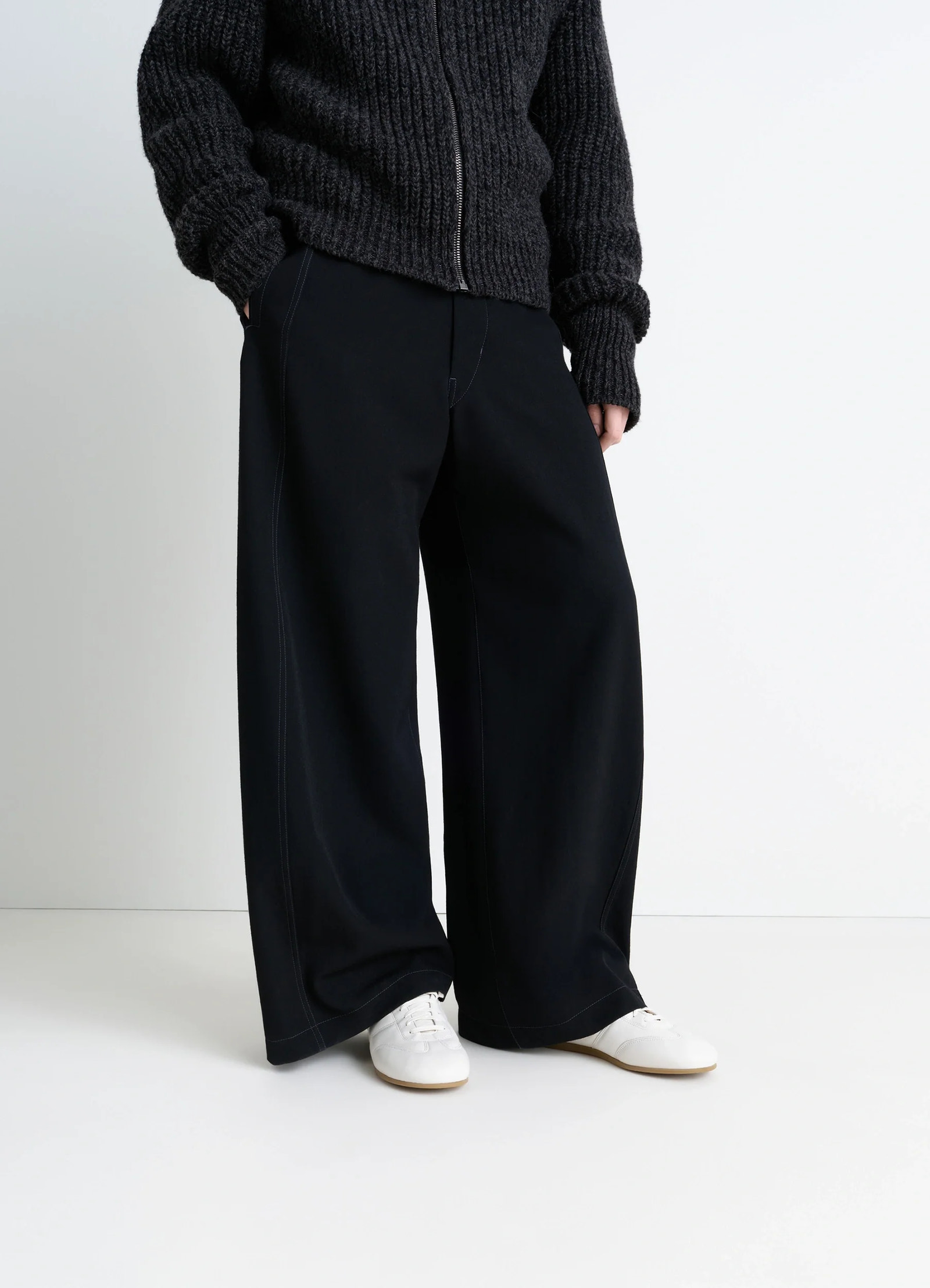 Inspired by vintage running sneaker in lwg gold-certified nappa lamb leath, model shot, worn front view minimalist lacing, cl