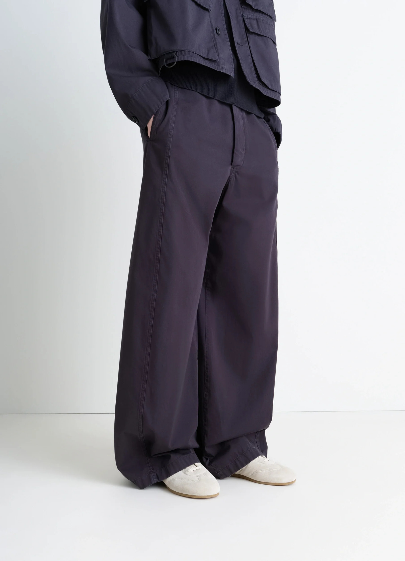 Soft runner in cream hand-sueded lambskin, model shot, worn by model detail shot vintage sneakers, padded panels