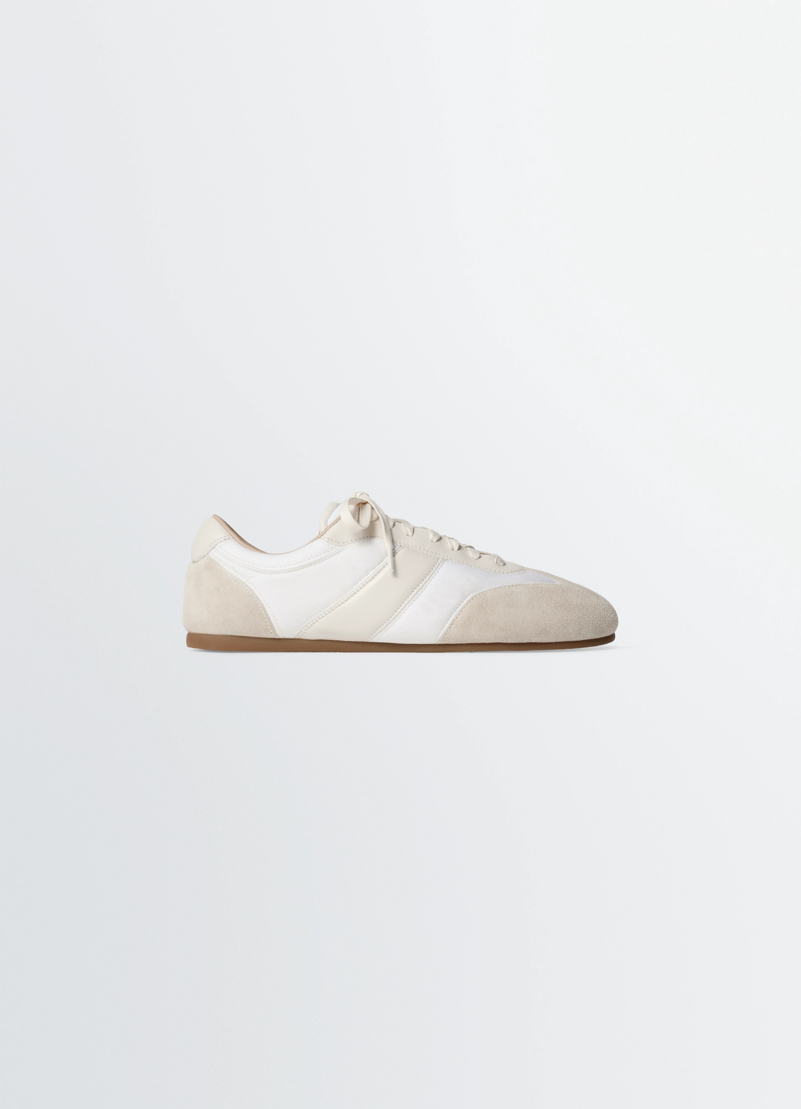 Soft runners in suede leather, product shot, side view topstitched cut-outs