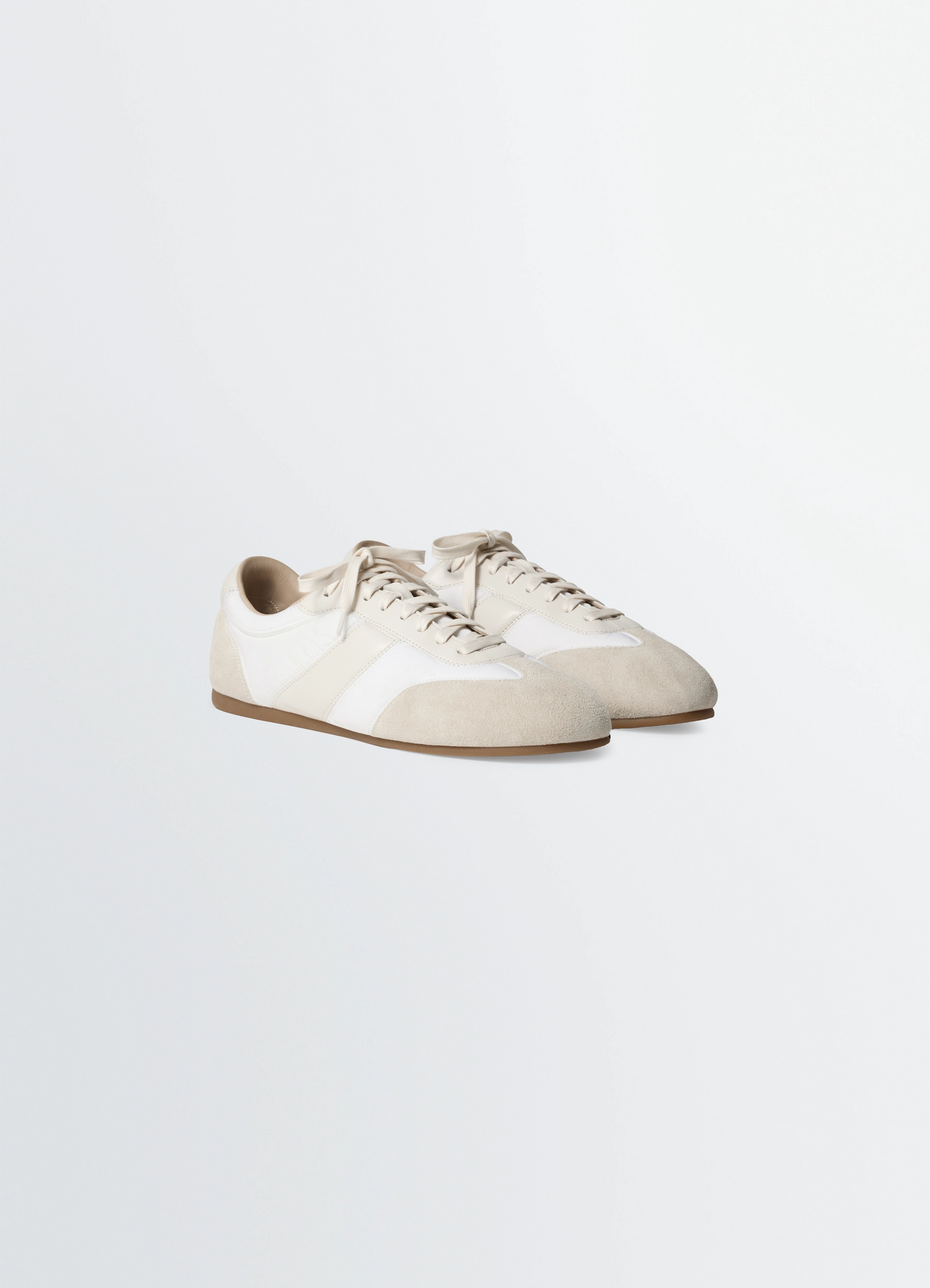 Soft runners in suede leather, product shot, angled front view low profile sleek design