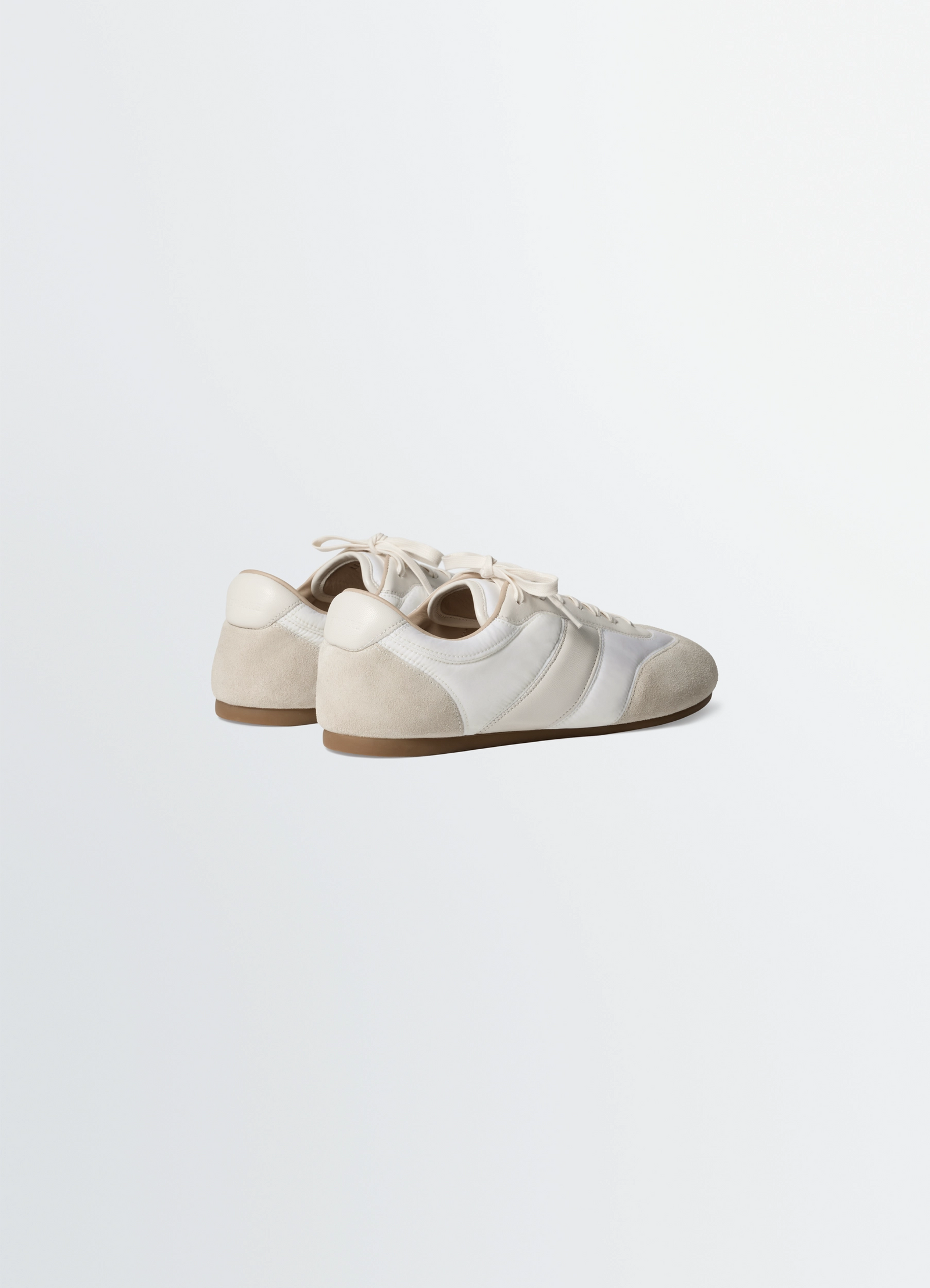 Soft runners in suede leather, product shot, rear three-quarter view contrasting suede texture