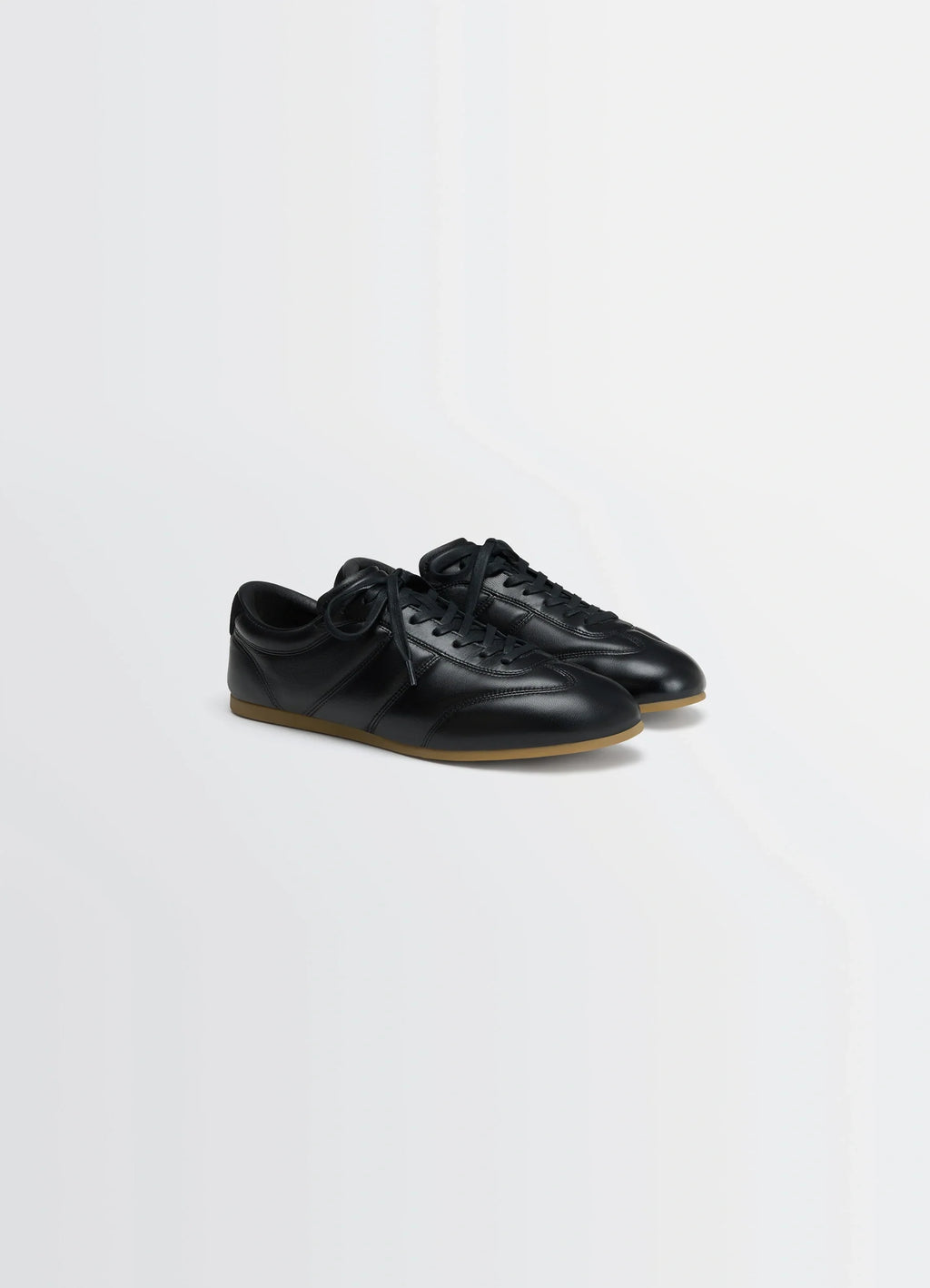 SOFT RUNNER in Black LWG Gold-certified nappa lamb, product shot, angled top view sleek lace-up design