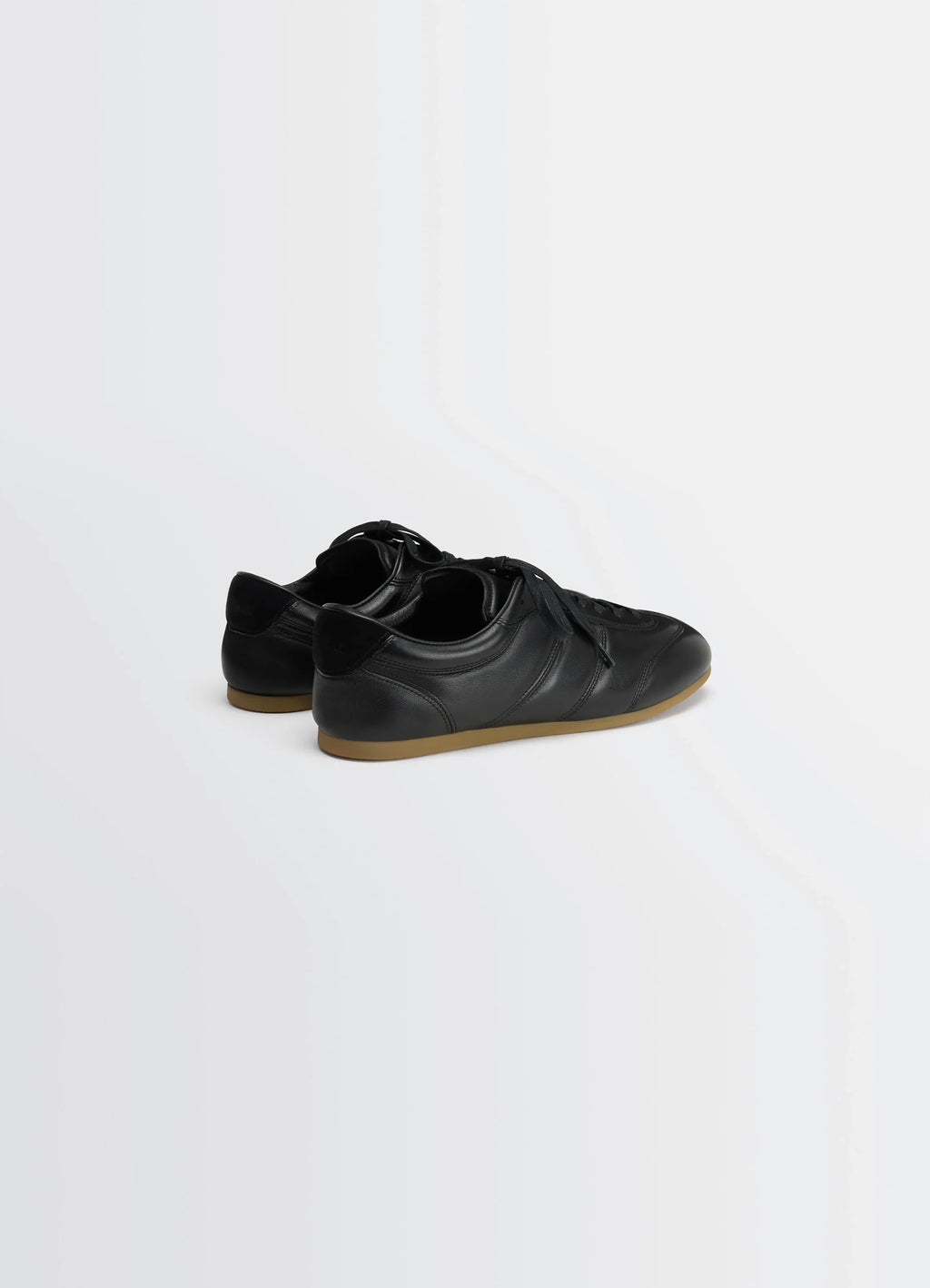 SOFT RUNNER in Black LWG Gold-certified nappa lamb, product shot, rear three-quarter view smooth leather texture