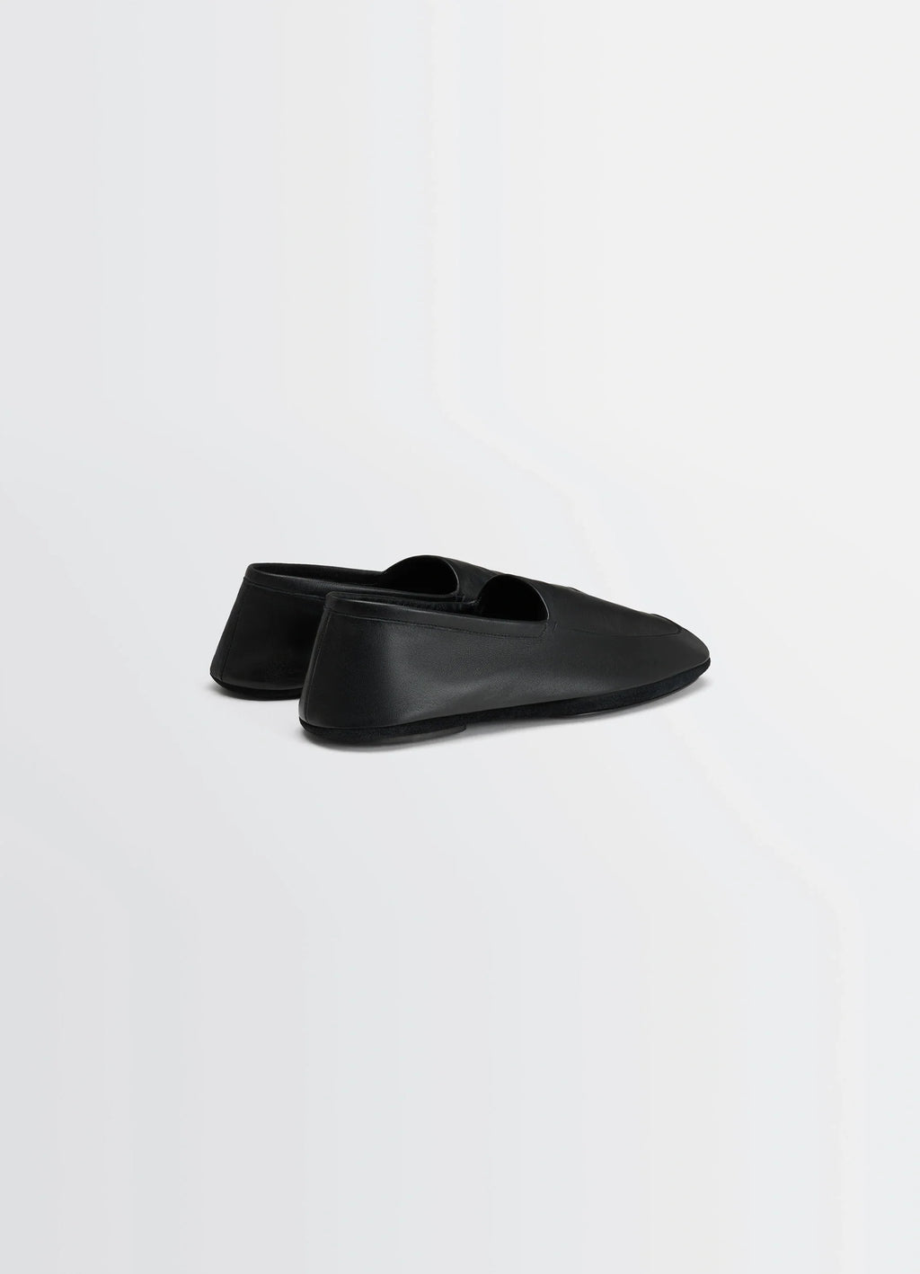 Indoor Slippers in Black Nappa Lamb Leather, product shot, rear angled view smooth rounded heel