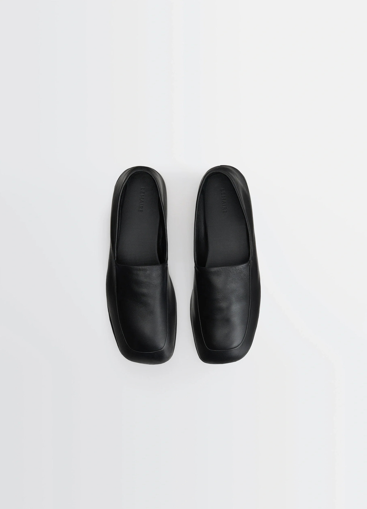 Indoor slippers in black nappa lamb leather, product shot, top down view smooth square toe design