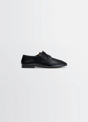 Lemaire Dance Derbies in Black Calf Leather, product shot, side view smooth shiny appearance