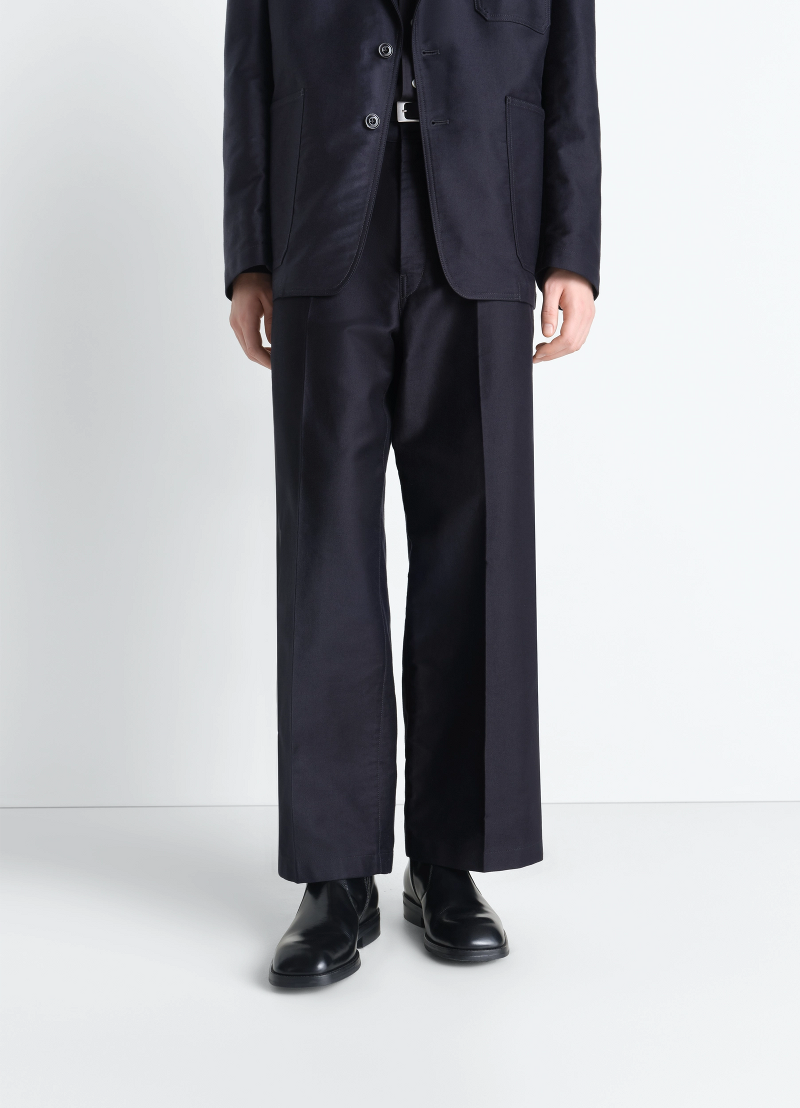 Zipped boots in leather in black calf leather, model shot, front view worn with straight pants