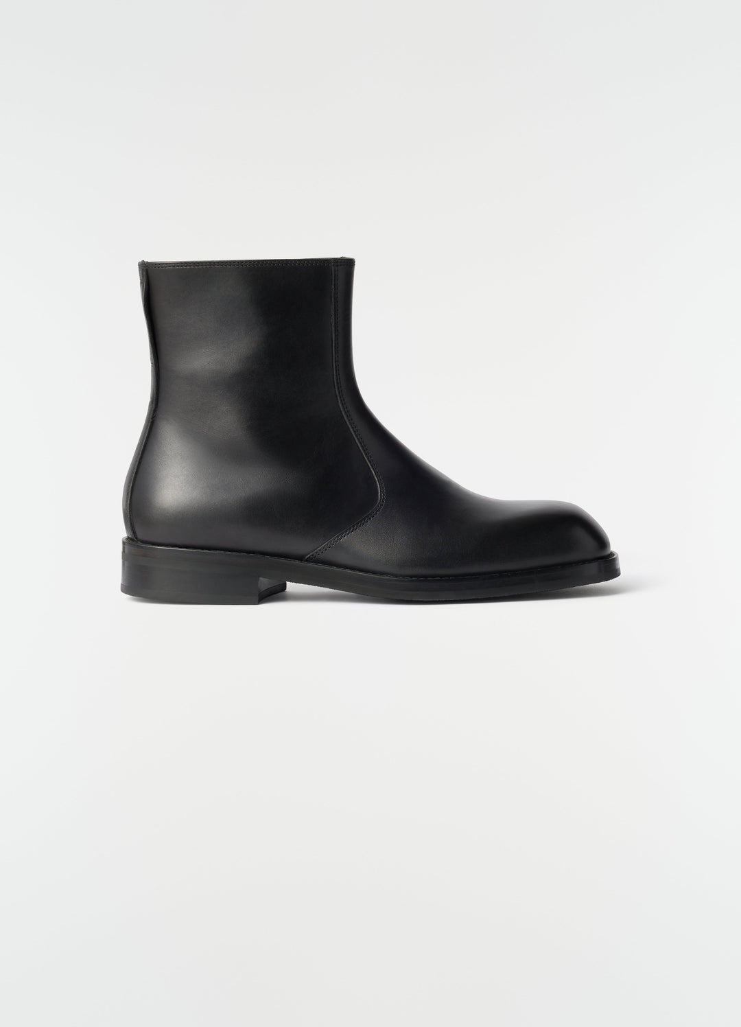 Zipped black shiny leather ankle boots LEMAIRE side view on plain white background
