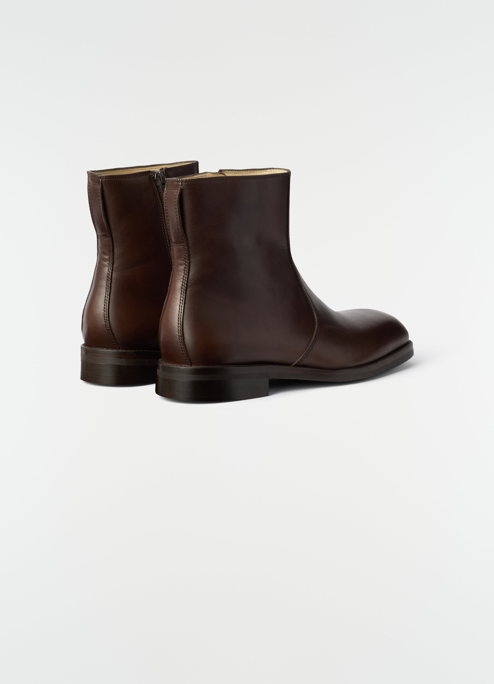 Zipped ankle boots lemaire in shiny brown leather shown from back on plain white background