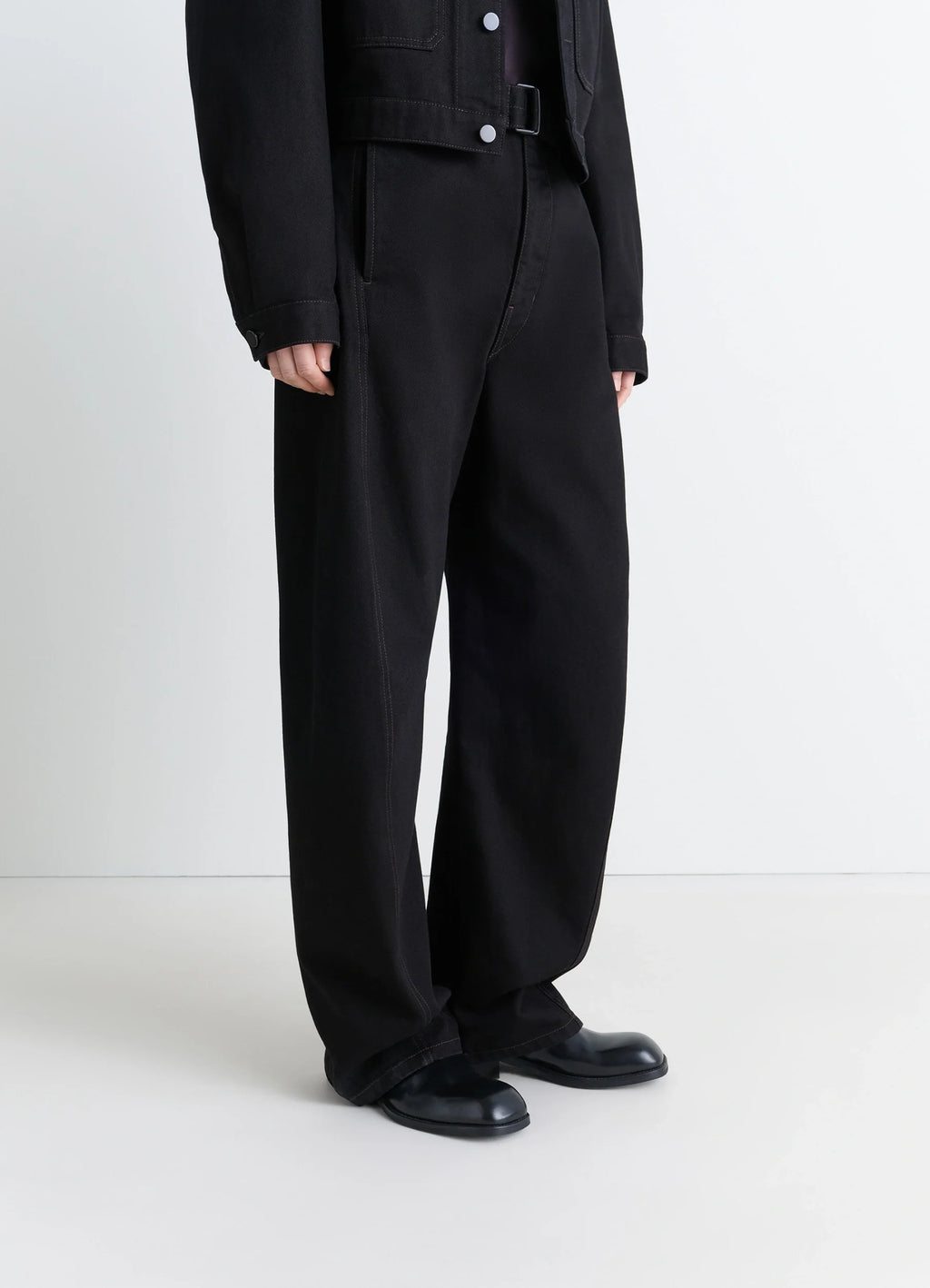 Zipped Boots in Black Calf Leather, model shot, Side view Wide leg pants