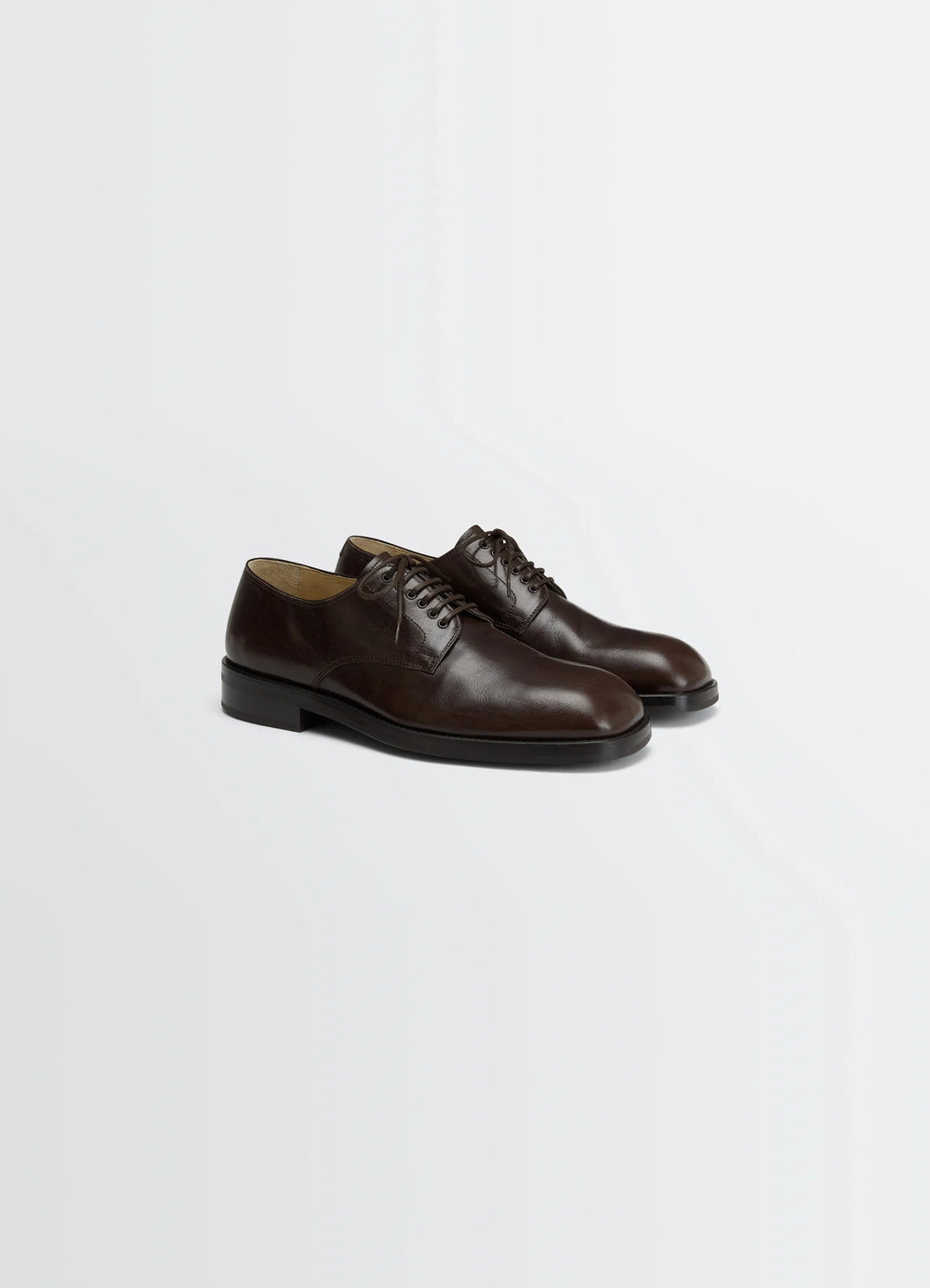 Derbies in Glossy Buffalo Leather, product shot, angled top view sleek almond toe design