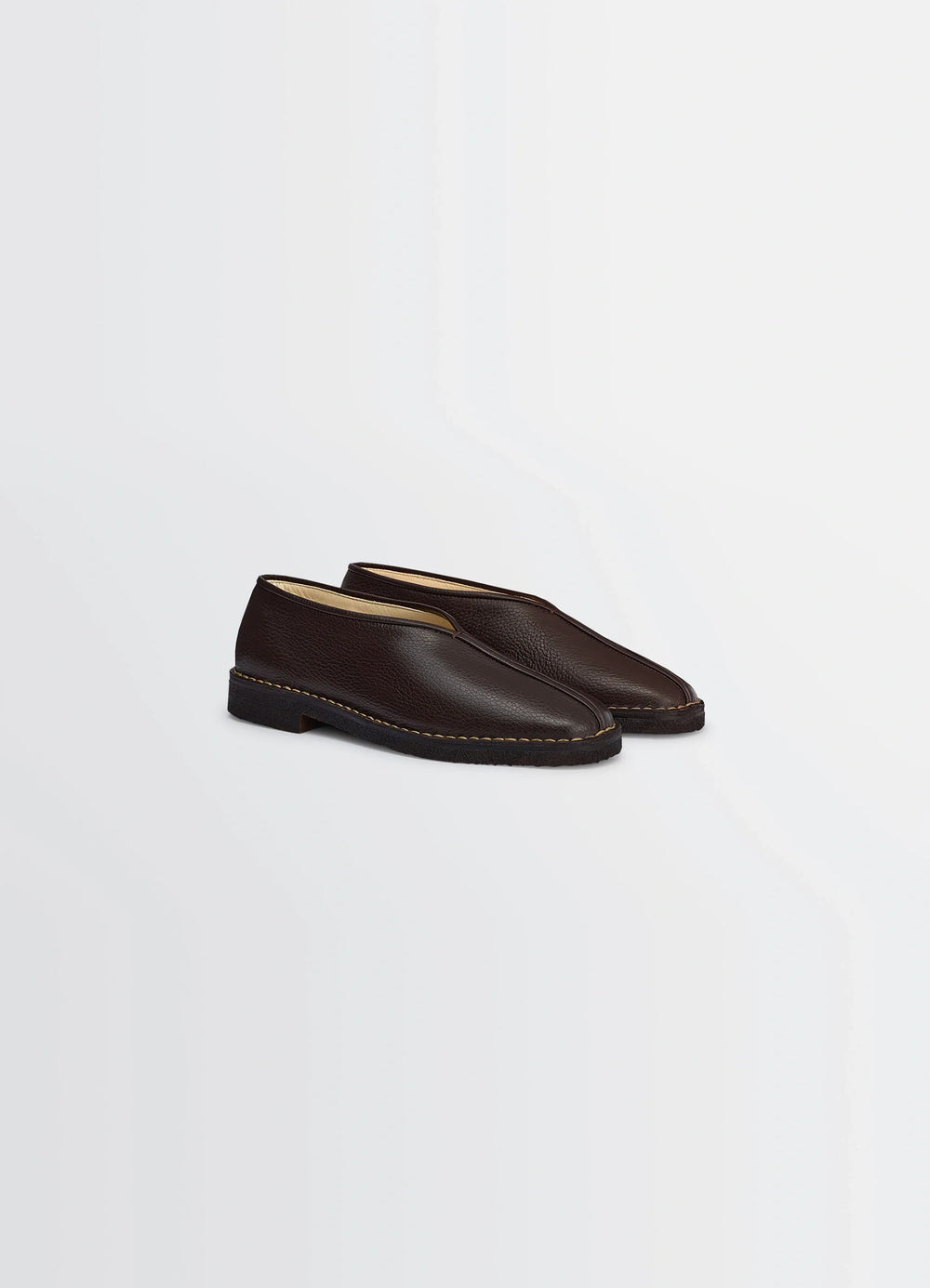 Lemaire Piped Crepe Slippers in Brown LWG Gold-certified leather, product shot, three-quarter view stitched leather outsole