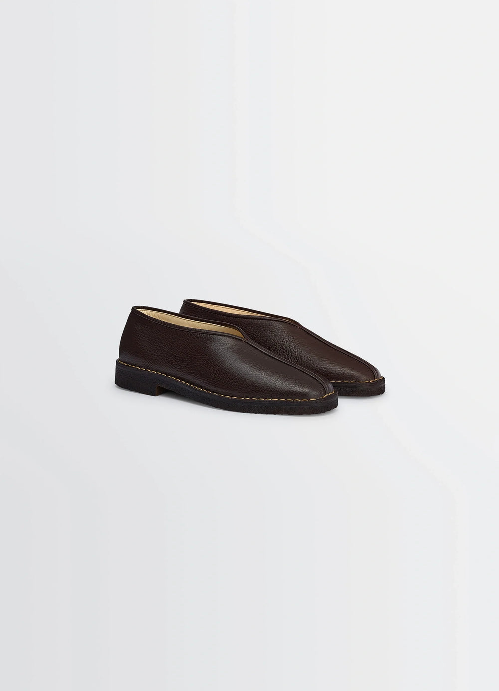 Lemaire Piped Crepe Slippers in Grained Leather, product shot, three-quarter view minimalist piping