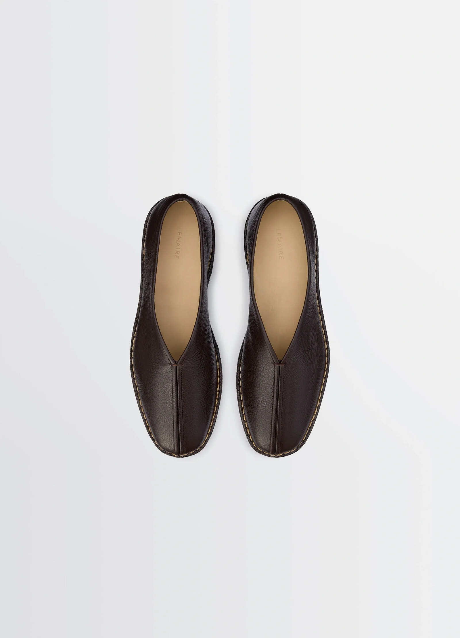 Lemaire piped crepe slippers in grained leather, product shot, top view pair alignment contrast sole stitching