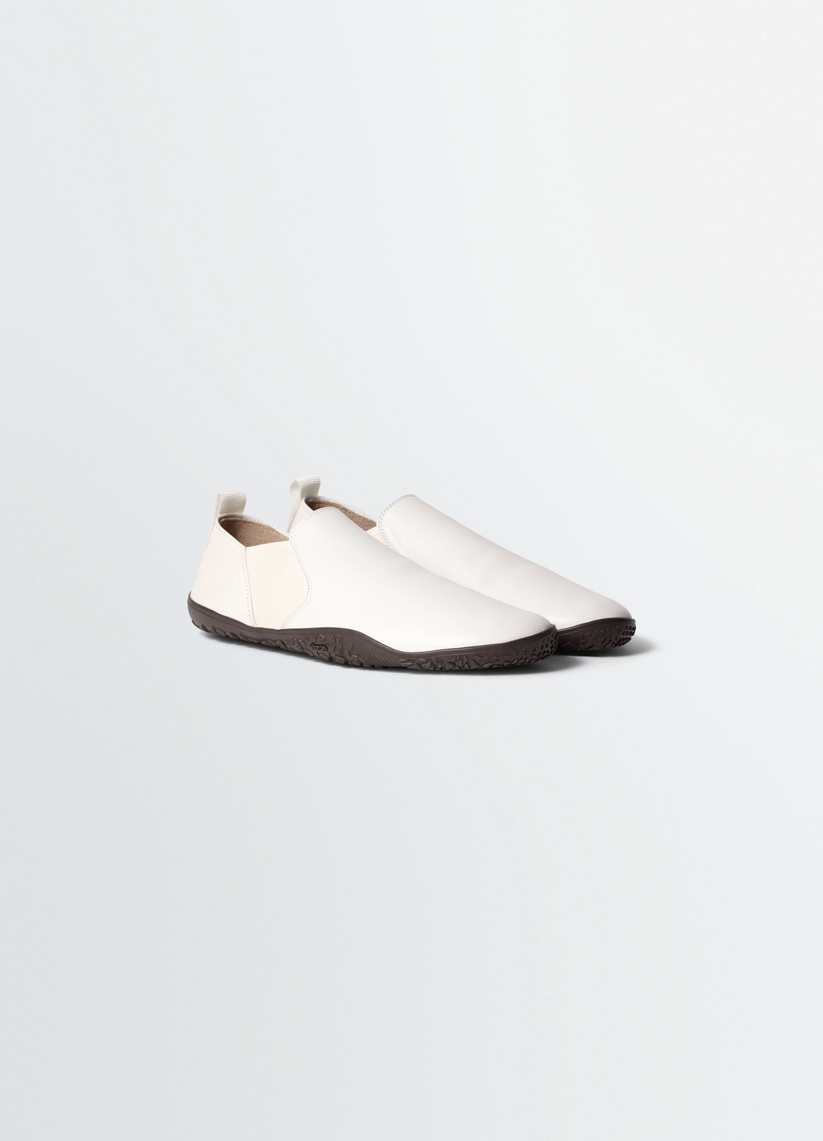 Vibram glove slip on in leather, product shot, three-quarter view sleek textured sole