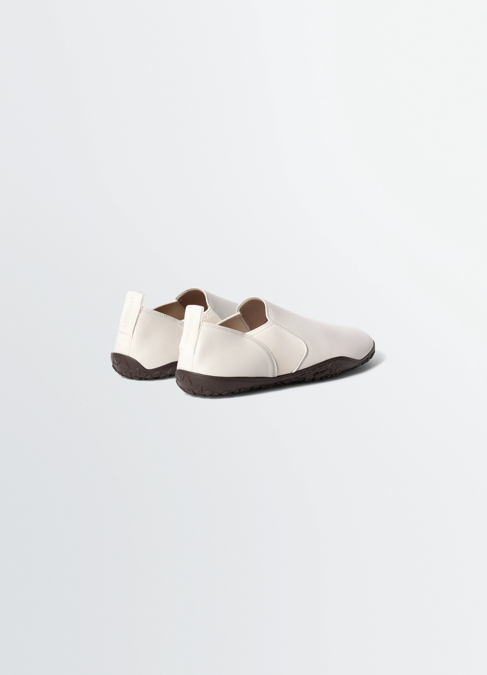 Vibram glove slip on in leather, product shot, rear angled view contrasting sole