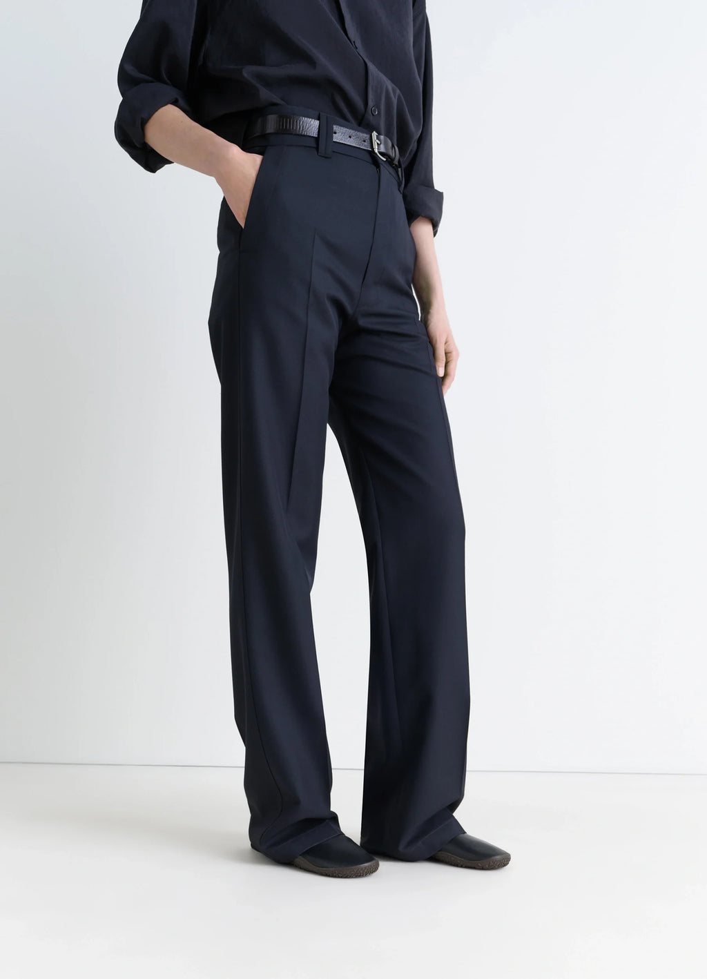 VIBRAM GLOVE SLIP ON in Black Nappa Lamb Leather, model shot, porte front view worn with wide leg pants