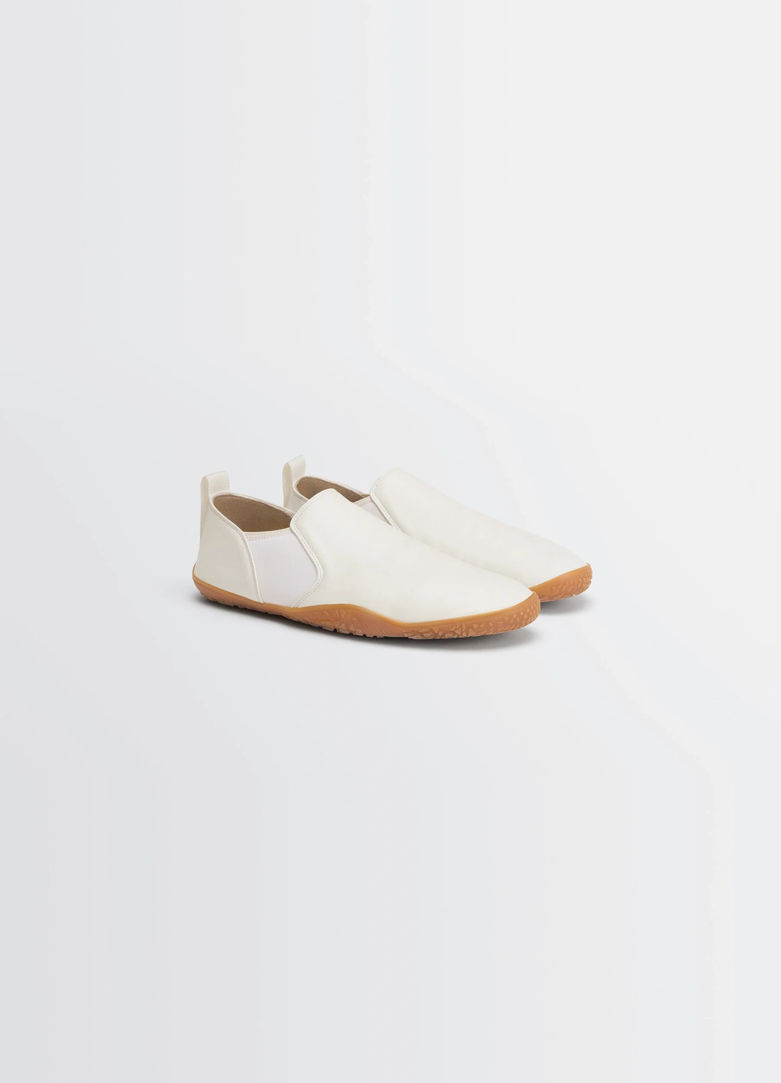 Vibram glove slip on in nappa lamb leather, product shot, angled top-down view streamlined silhouette