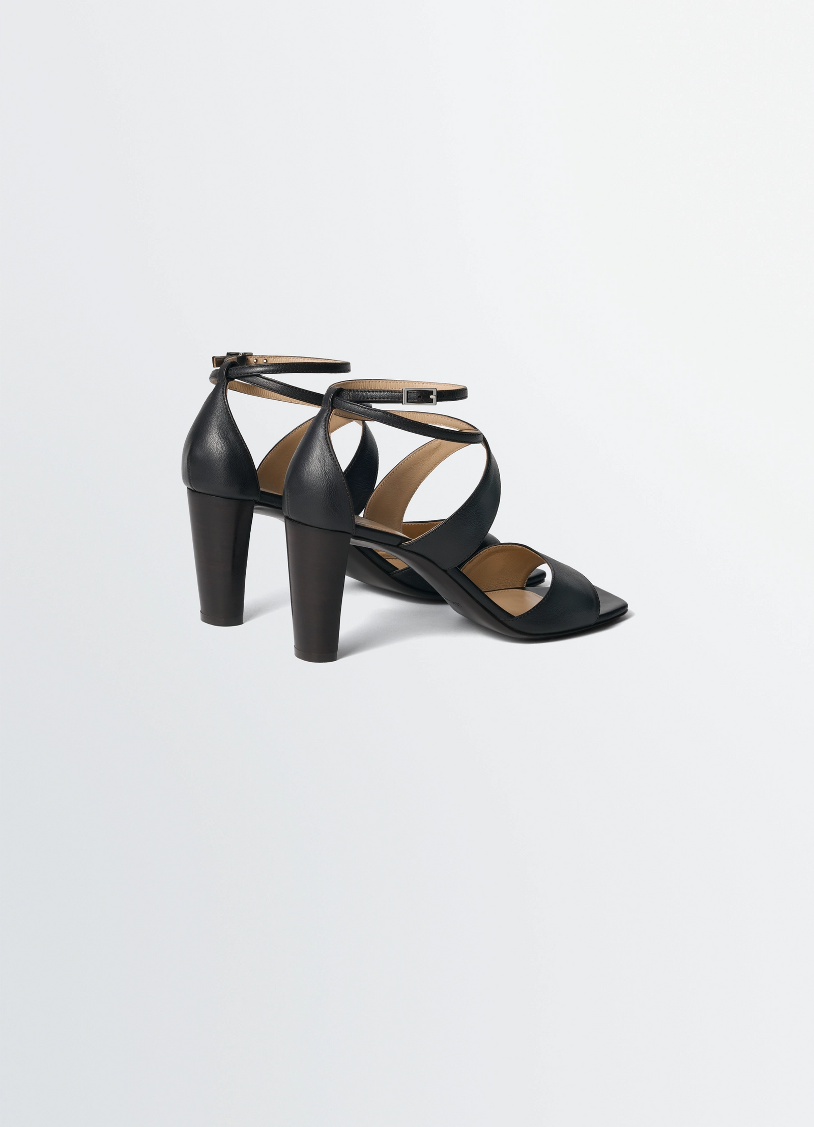 Cross sandals 80 mm heel in lamb nappa leather, product shot, back three-quarter view smooth round heels