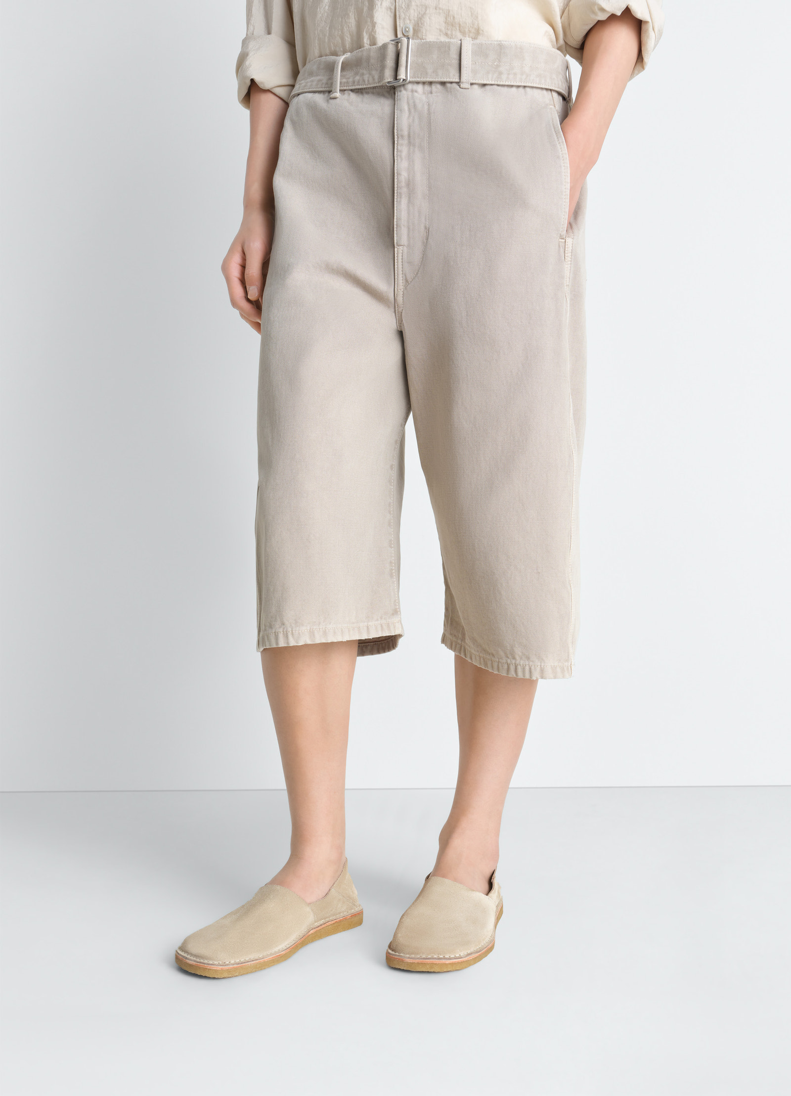 Square slip-on loafers in suede leather, model shot, front angled view minimalistic design