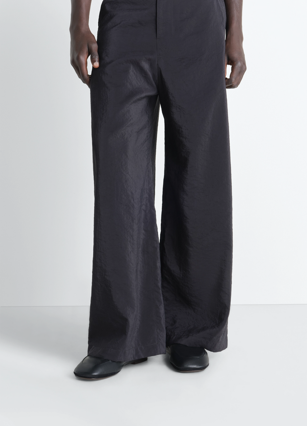 Outdoor Slippers in Black Nappa Lambskin, model shot, front view worn with wide pants