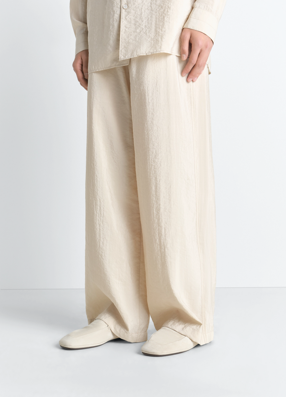 Outdoor Slippers in Suede Leather in Suede Leather, model shot, three-quarter view loose fit trousers visible