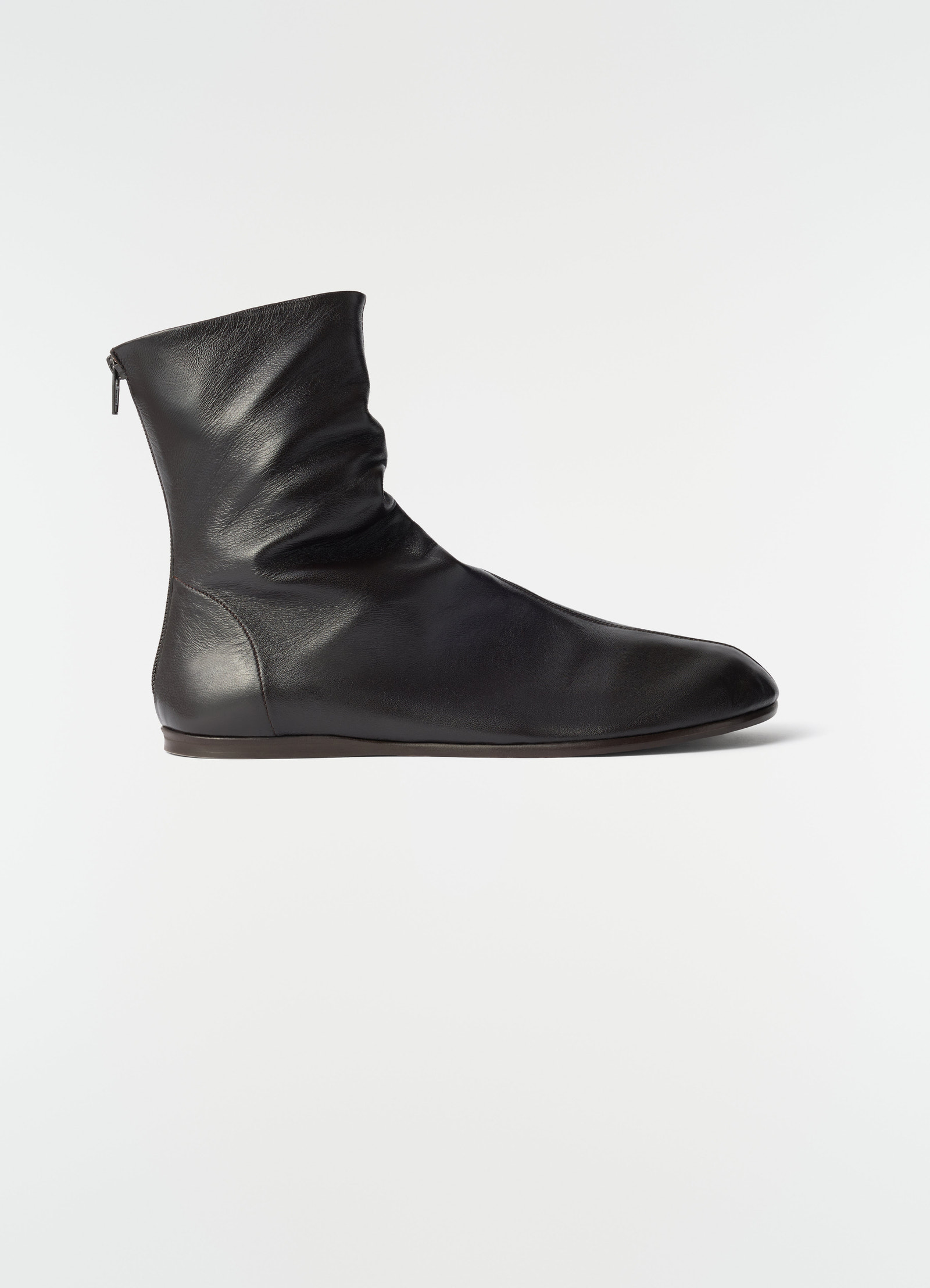 Sock ankle boots in shiny black nappa lambskin by lemaire side view on plain white background