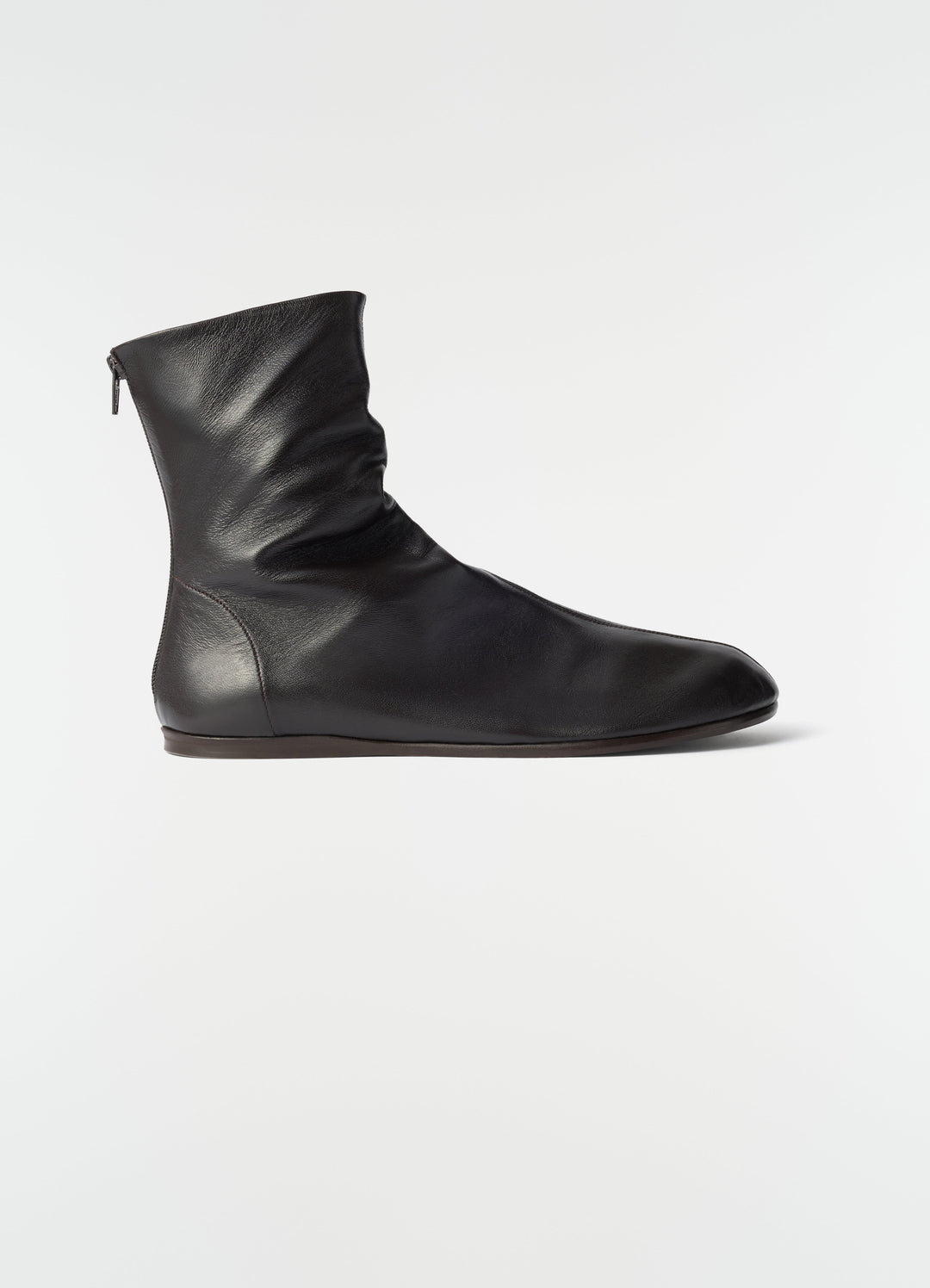 Sock ankle boots in shiny black nappa lambskin by LEMAIRE side view on plain white background