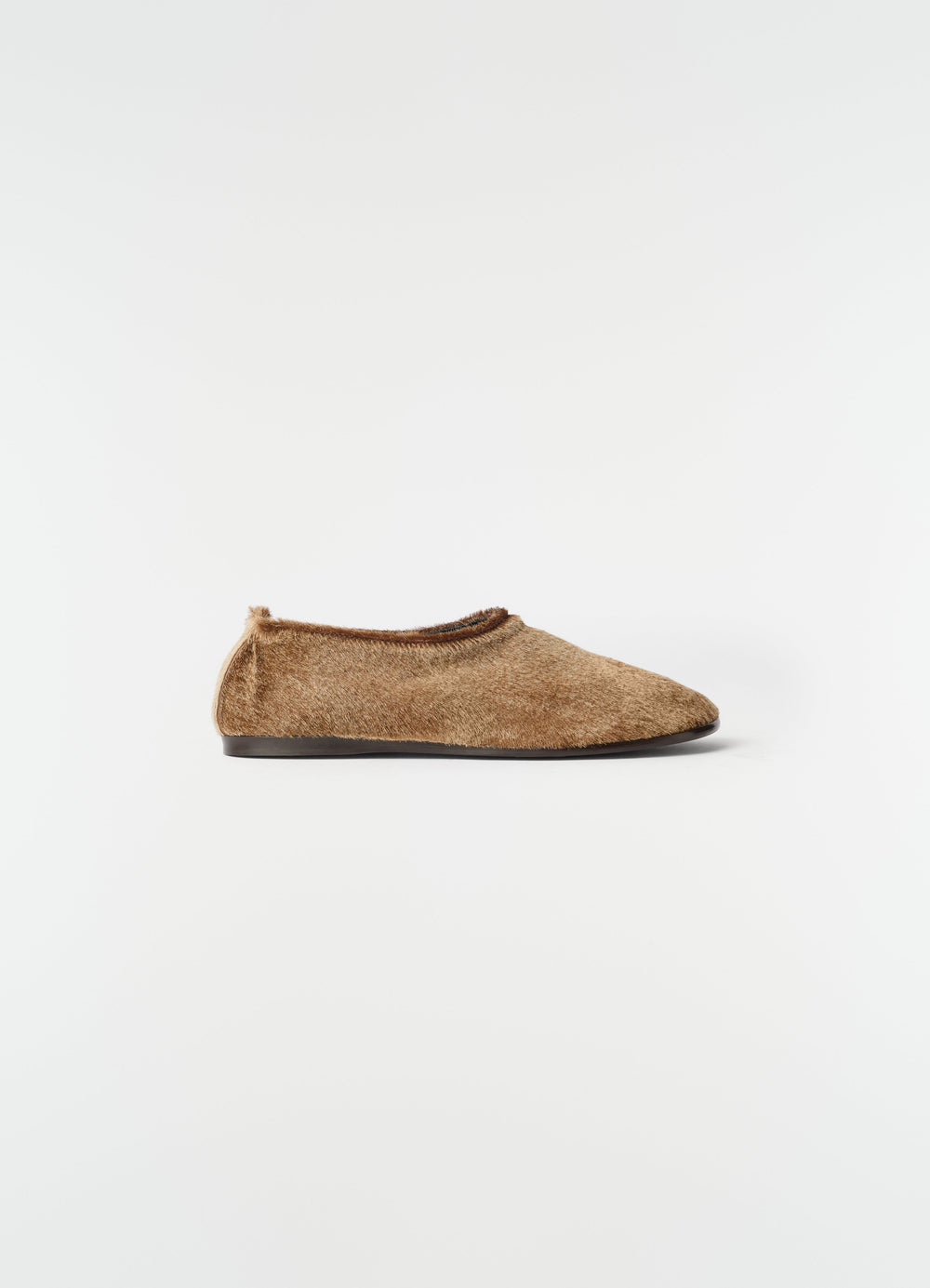 Glove slip-on shoes in natural brown pony-style leather by LEMAIRE side view on white background