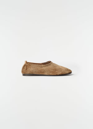 Glove slip-on shoes in natural brown pony-style leather by lemaire side view on white background