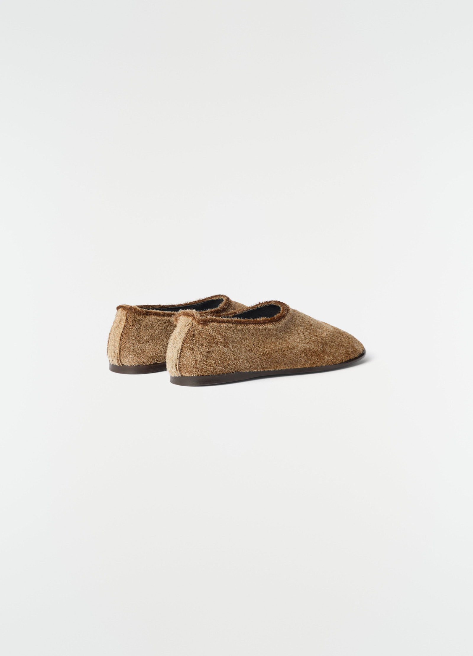 Glove slip-ons in natural pony-style leather brown with black sole by lemaire side view on white background
