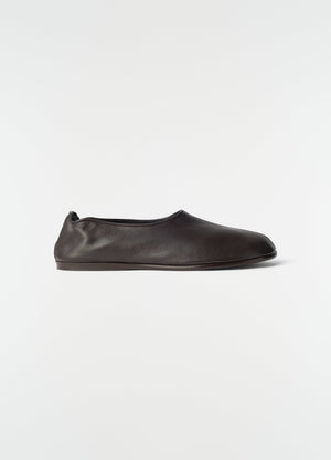 Sock slip-ons in dark brown goat leather by lemaire side view on plain white background