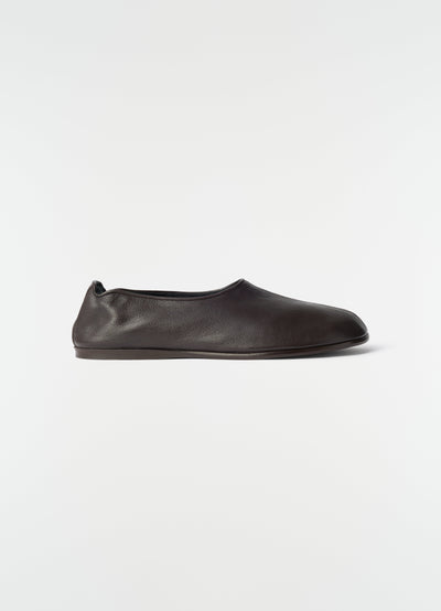 Sock slip-ons in dark brown goat leather by LEMAIRE side view on plain white background