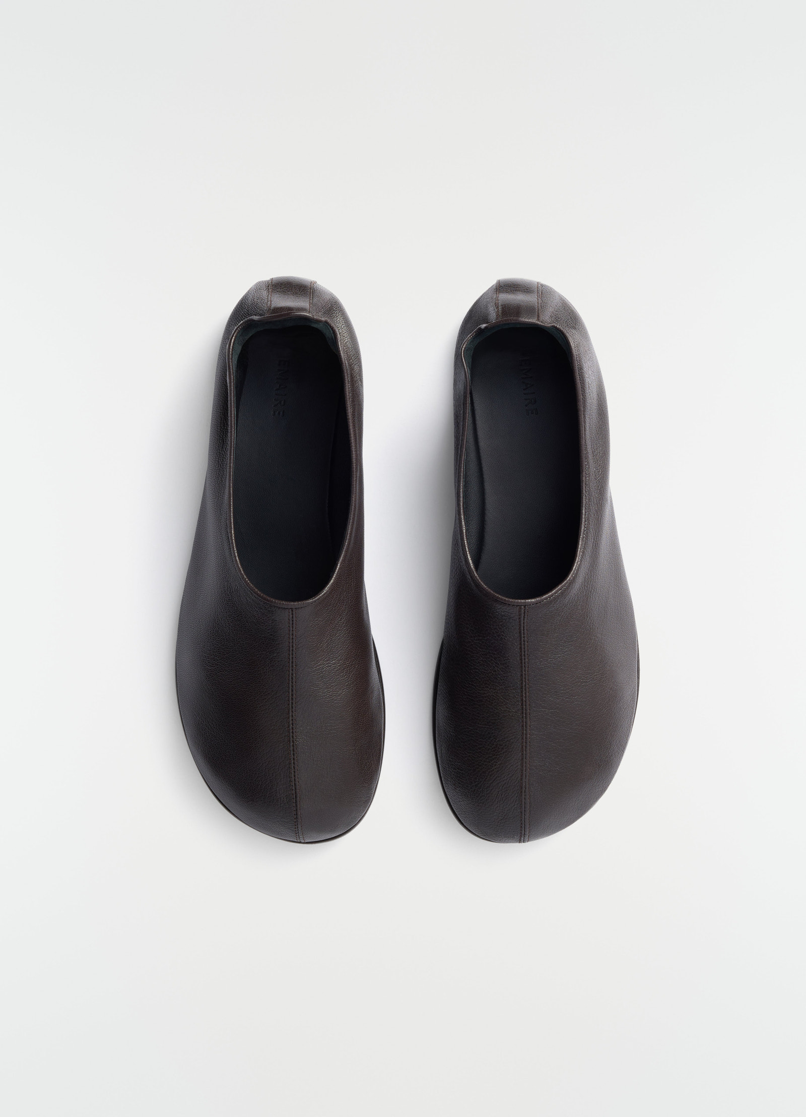Sock slip-ons in dark brown goat leather lemaire top view on plain white background