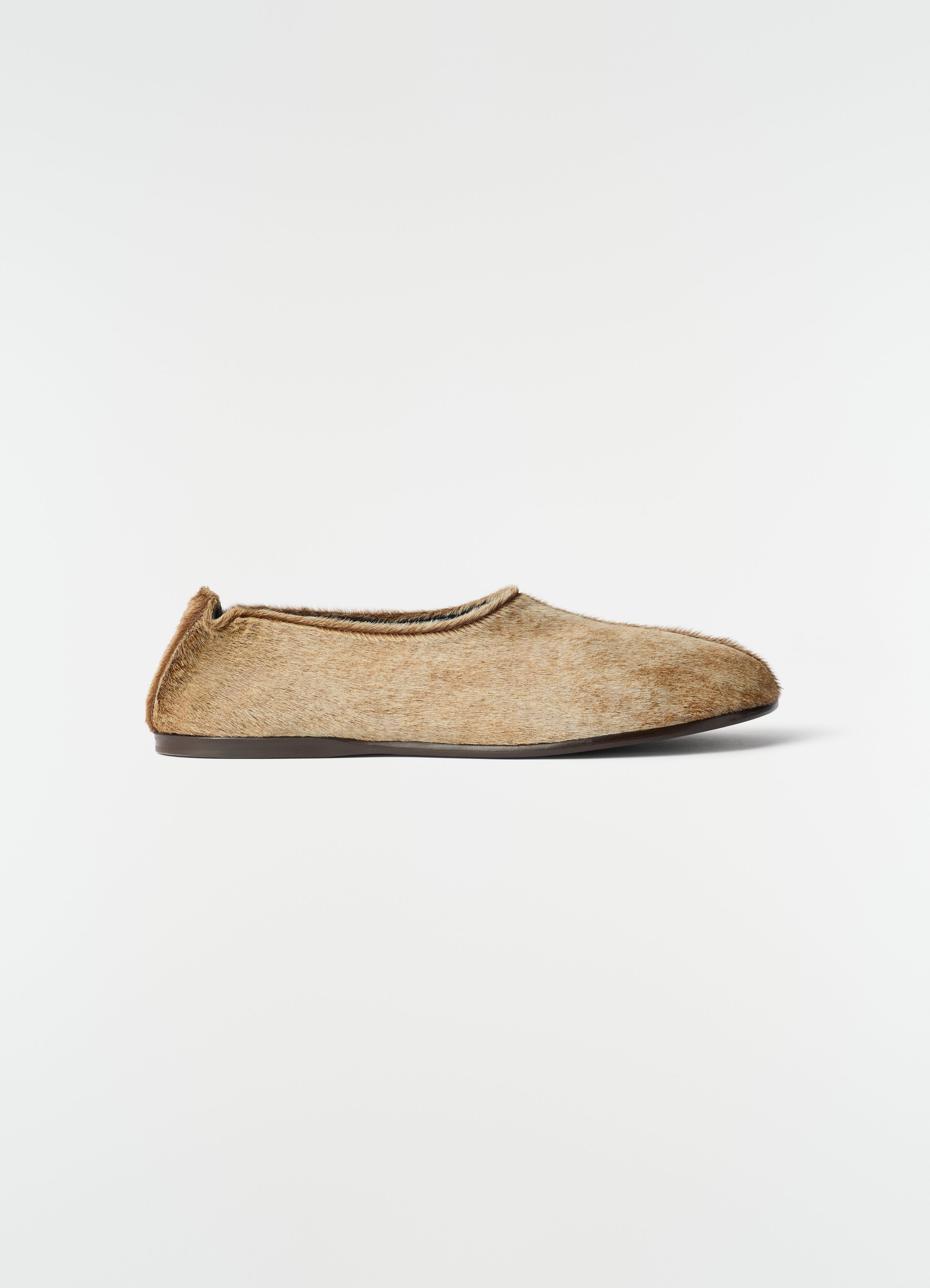 Sock slip-ons in natural pony-style leather with dark sole lemaire side view on white background