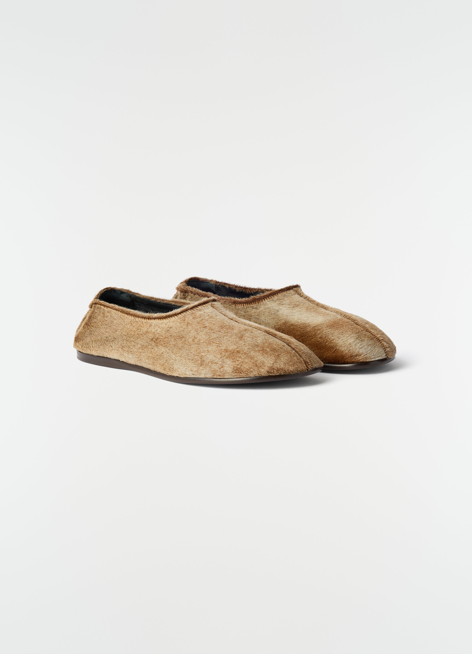 Sock slip-ons in natural pony-style leather with brown trim lemaire front view on plain white background