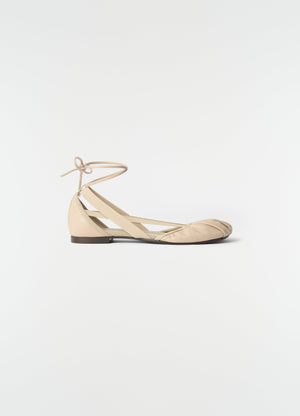 Flat pedille ballerinas in beige goat leather with ankle tie and elastic strap by lemaire side view on white background