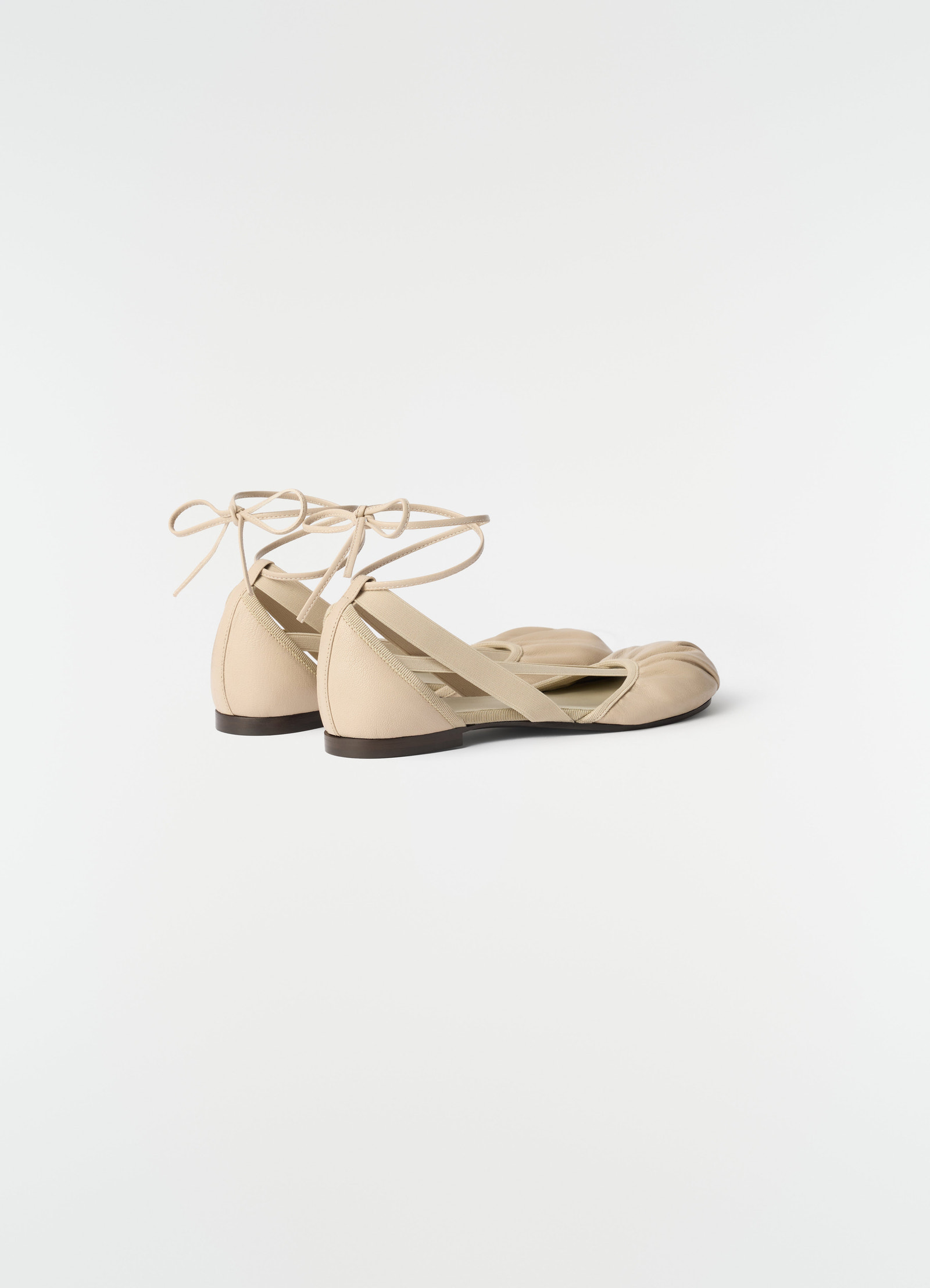 Flat pedille ballerinas in beige goat leather by lemaire side view on plain white background