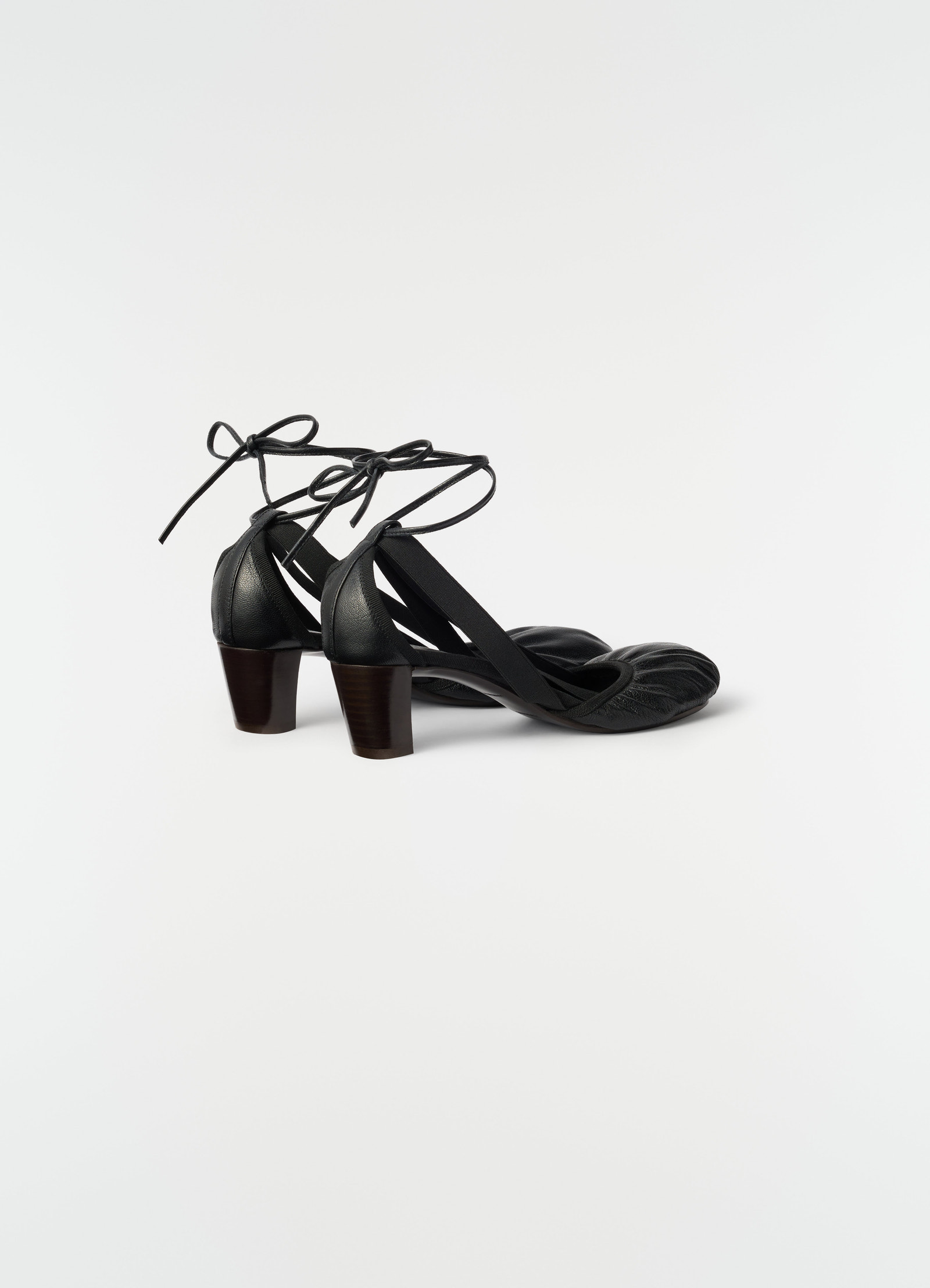 55 mm black goat leather heeled ballerinas by lemaire side view on white background with ankle ties