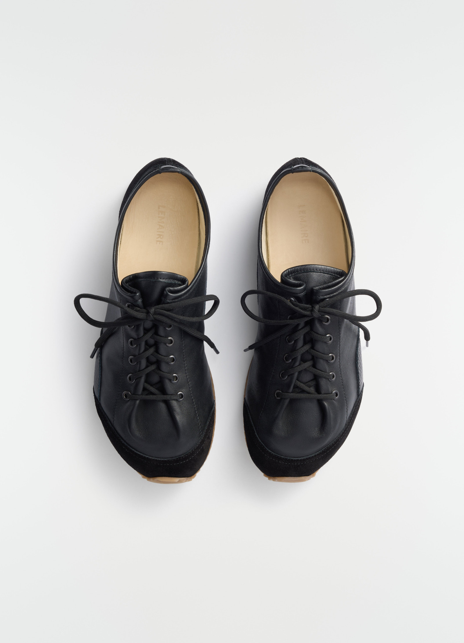 Gummy grips sneakers in mixed leathers